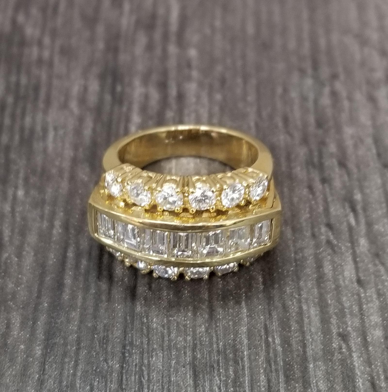 14k yellow gold 3 row diamond wedding ring, containing 7 baguette cut diamond weighing 1.00cts. and 12 round full cut diamonds weighing 1.50cts.; color 