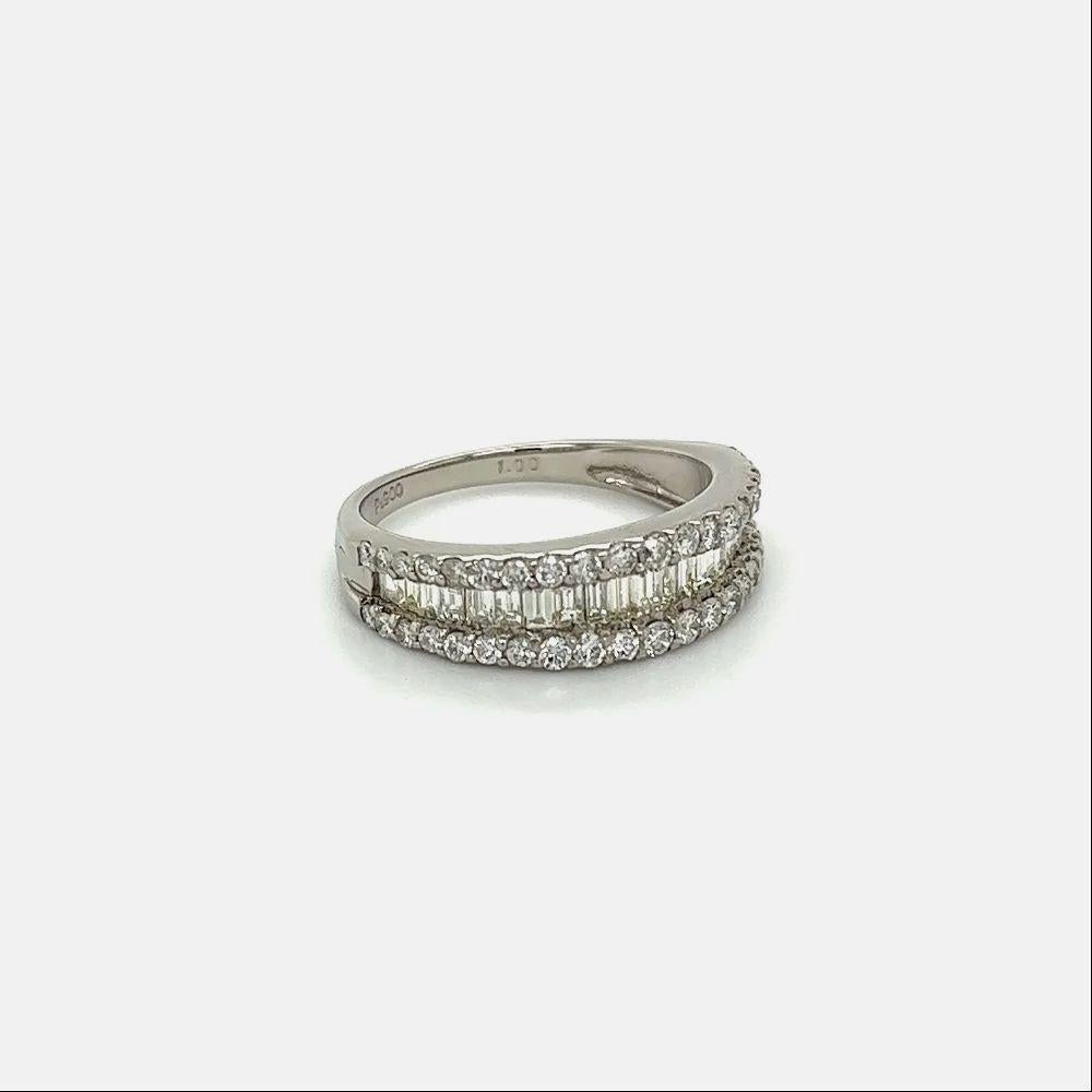 Simply Beautiful! Vintage Baguette and Round Brilliant cut Diamond Platinum Half Eternity Band Ring. Centering Hand set Baguette Diamonds surrounded by Round Brilliant cut Diamonds. Diamonds weighing approx. 1.00tcw. Hand crafted Platinum mounting,