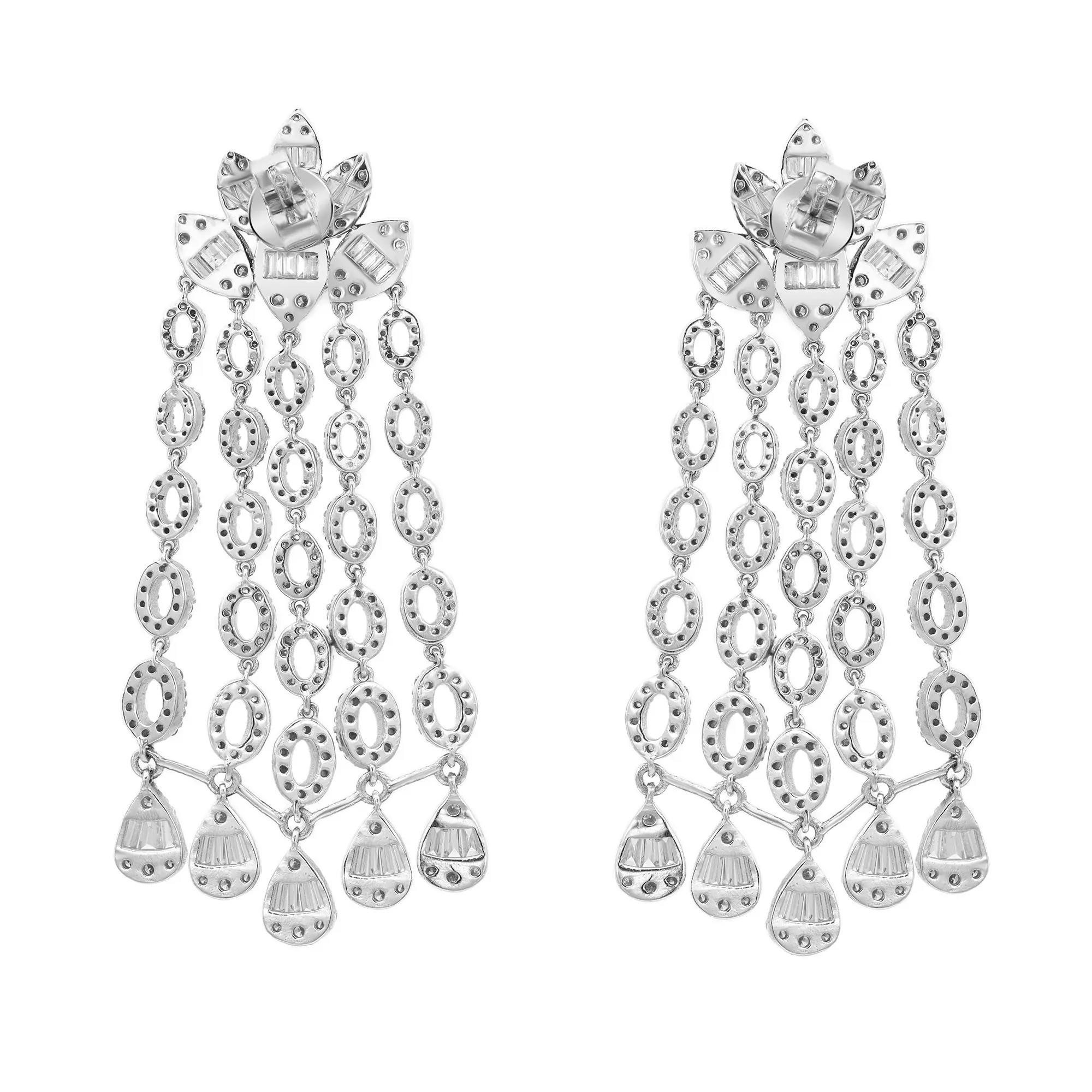 These wonderful pair of chandelier long drop earrings are designed in lustrous 14K white gold studded with channel set baguette and pave set round brilliant cut diamonds. Total diamond weight: 3.67 carats. Diamond color I-J and clarity SI.