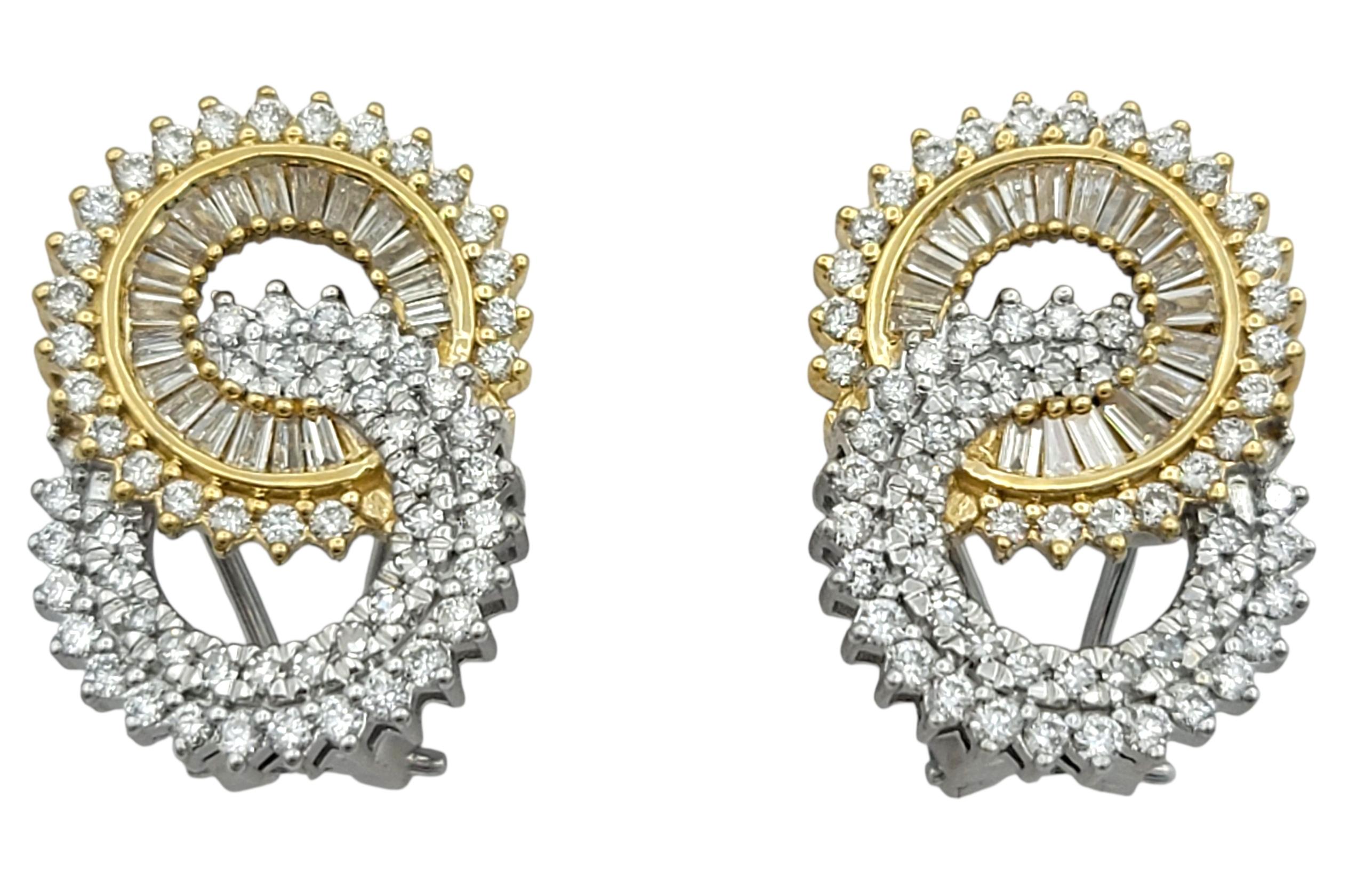 These sophisticated earrings feature a interlocking circle design crafted in 14 karat white and yellow gold, creating a striking contrast between warm and cool tones. The elegant pattern is adorned with baguette-cut diamonds arranged in a flowing