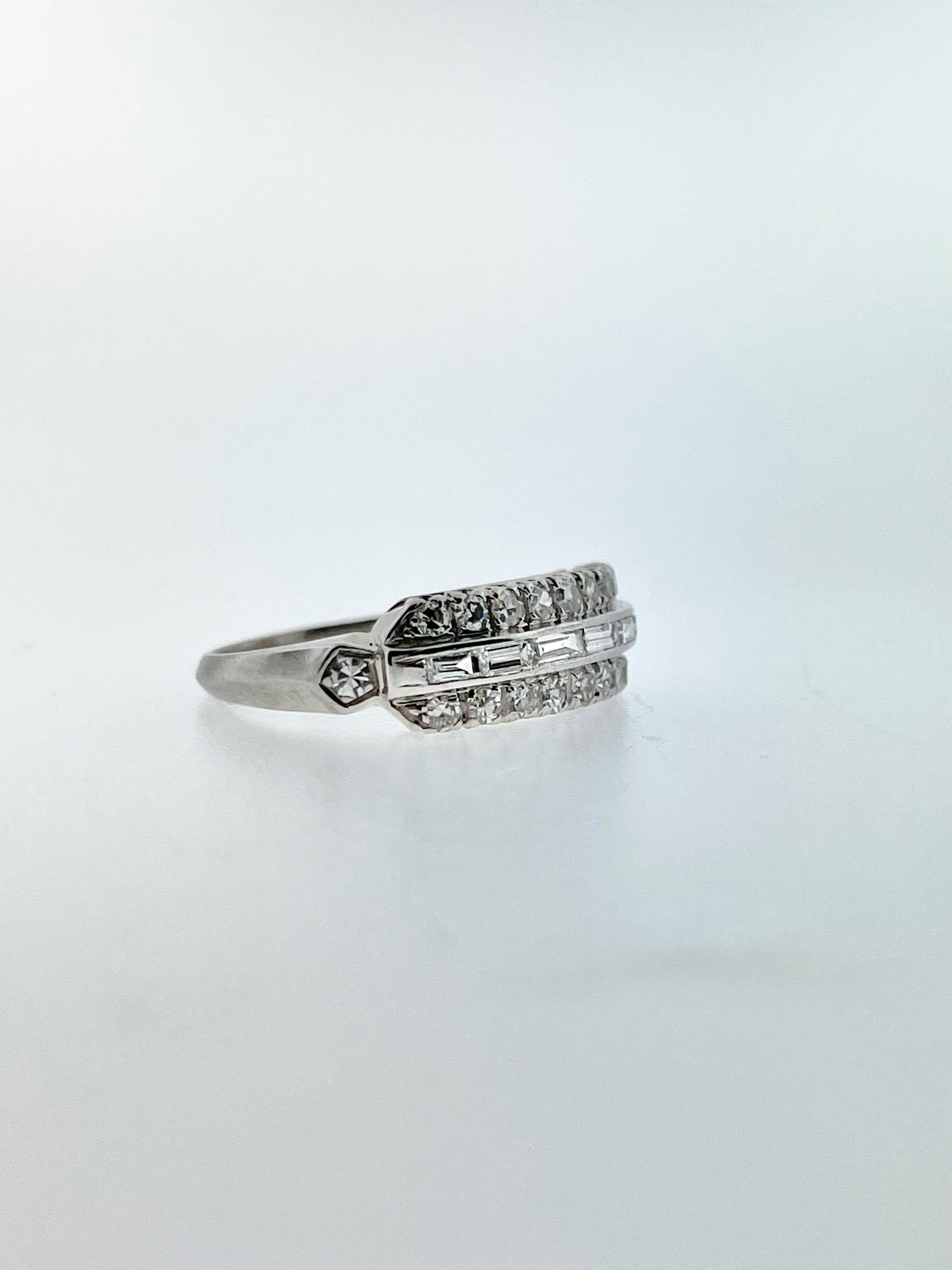 A beautiful vintage ring with stunning round and baguette diamonds all set in platinum! 