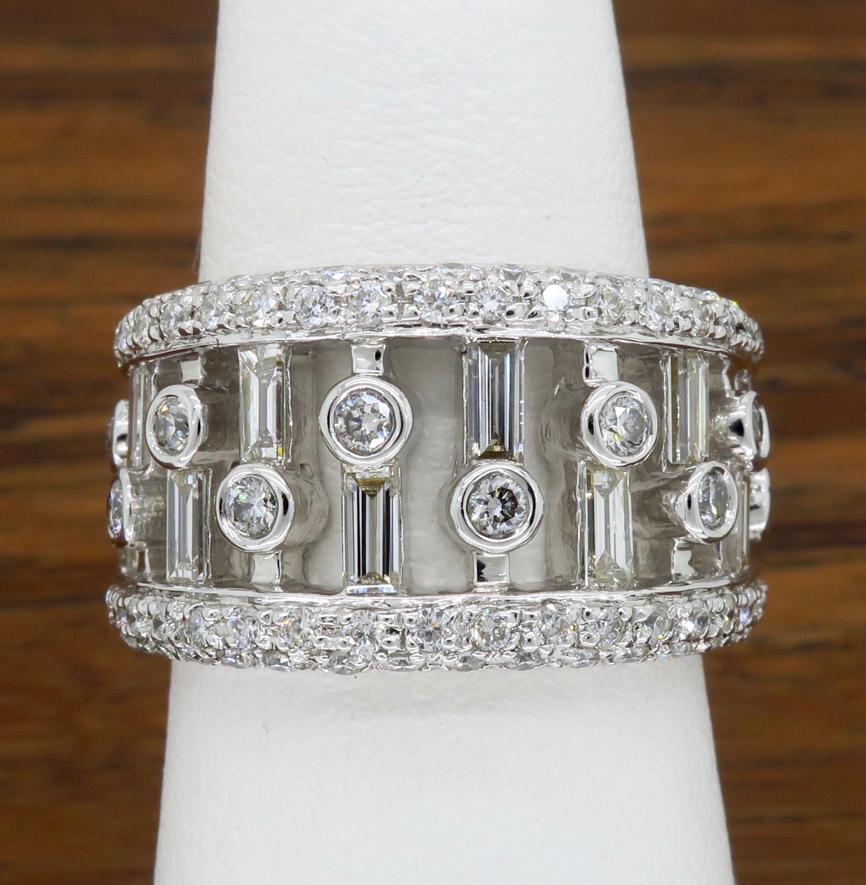 This unique negative space style diamond band features approximately 1.75ctw of Diamonds set in a stunning vertical row design.

Diamond Carat Weight: Approximately 1.75CTW
Diamond Cut: Baguette Cut and Round Brilliant Cut Diamonds
Color: Average