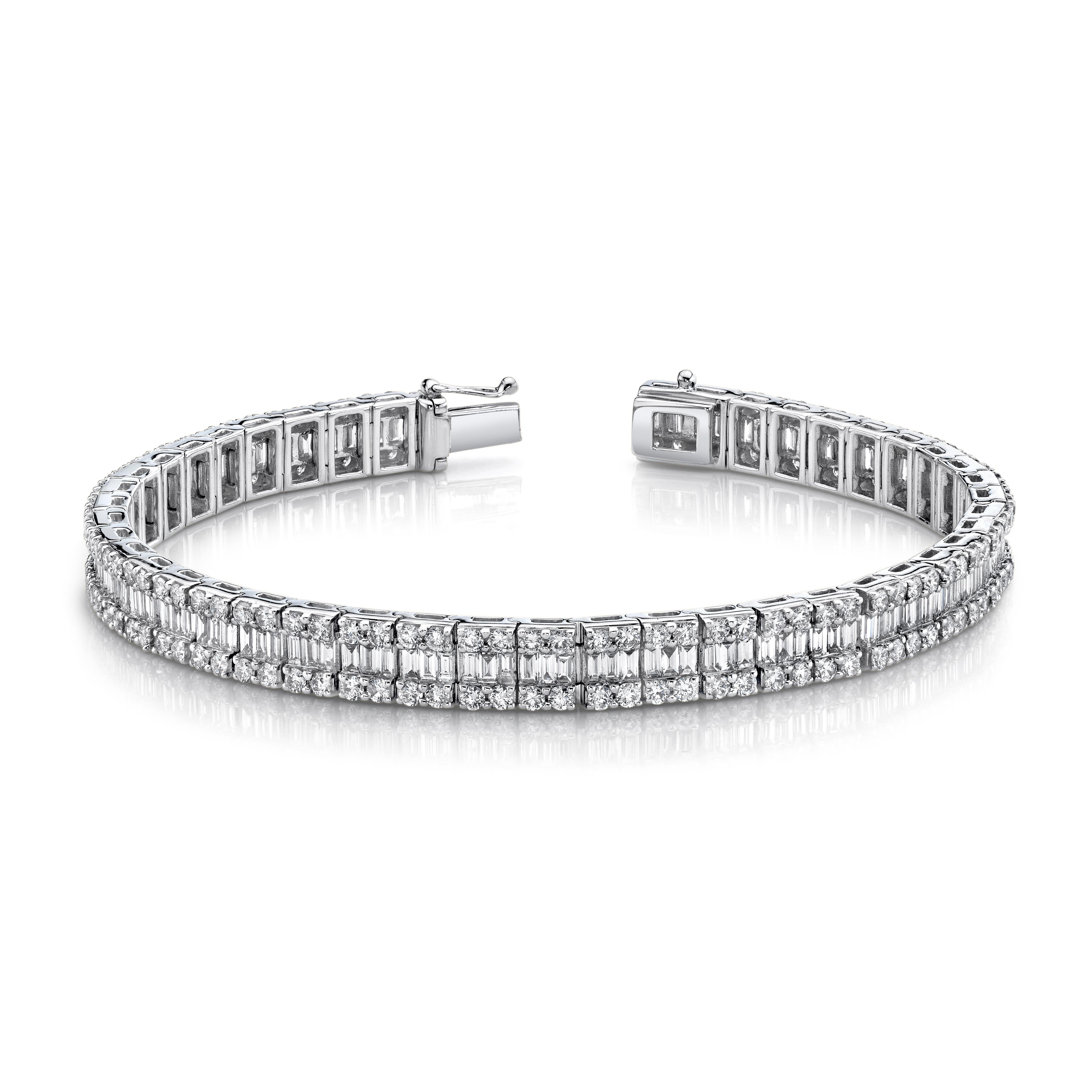 This magnificent diamond tennis bracelet features over 3 carats of baguette cut diamonds and over 4 carats of round brilliant cut diamonds set in 18k white gold. The center 