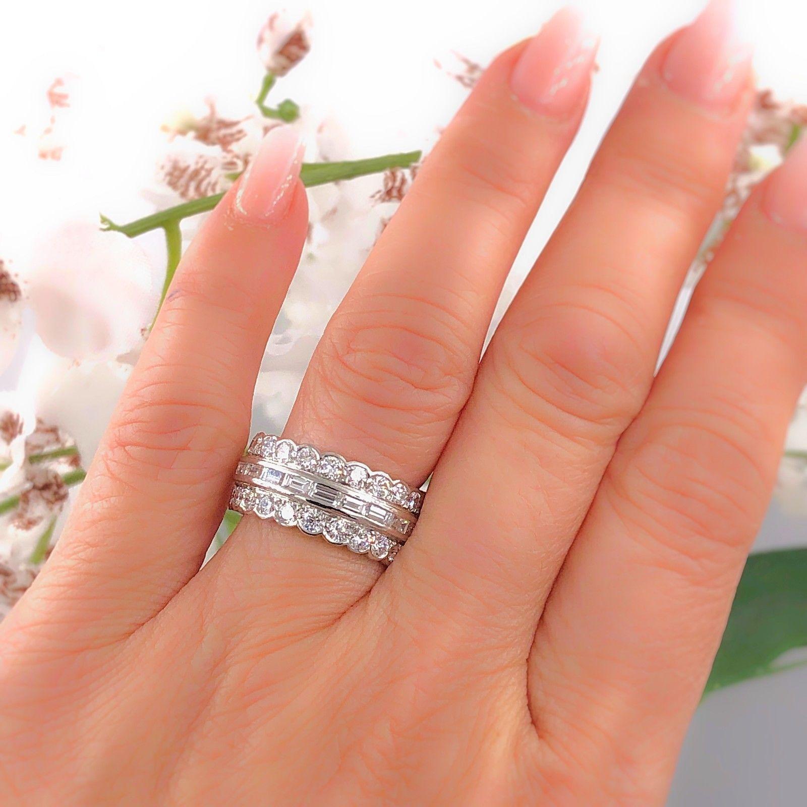 Style:  Diamond Band Ring
Metal:  Platinum
Width:  8.9 MM
Size:  6 
Total Carat Weight:  3.60 tcw
Diamond Shape: Baguette & Rounds
Rounds:  Double Row Bezel set 46 Round Diamonds 2.50 tcw F - G color, VS clarity
Baguettes:  Center Row of 21 Baguette