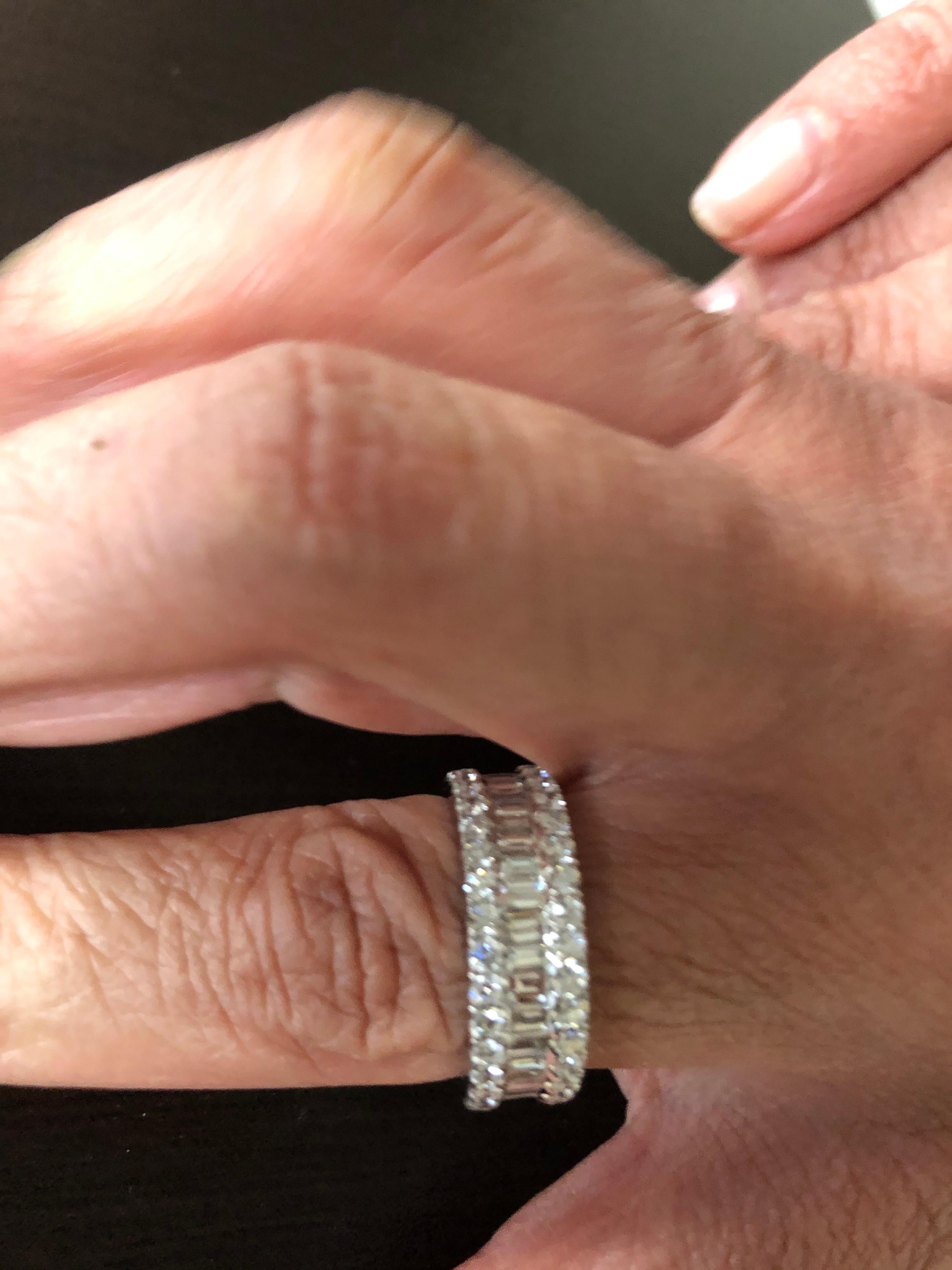 18K white gold ring set with baguette and round diamonds. The ring is set with 2 rows of round diamonds with the carat weight of 1.44. The middle row of the ring is baguettes weighing a total of 1.77 carats. Total weight of the band is 3.21 carats.