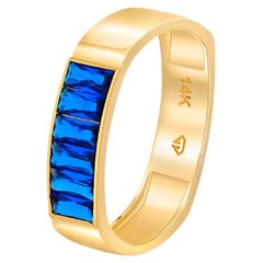 Anillo de media eternidad baguette con gemas azules de oro de 14k