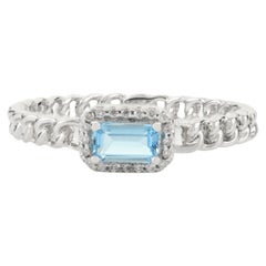 Anillo de compromiso aus 14 Karat Weißgold mit blauem Baguette-Topas und Halo-Diamanten