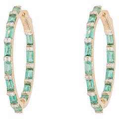 Pendientes de aro de diamantes en oro amarillo de 14 quilates con estallido de baguette