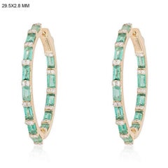 Pendientes de aro de diamantes en oro amarillo de 14 quilates con estallido de baguette