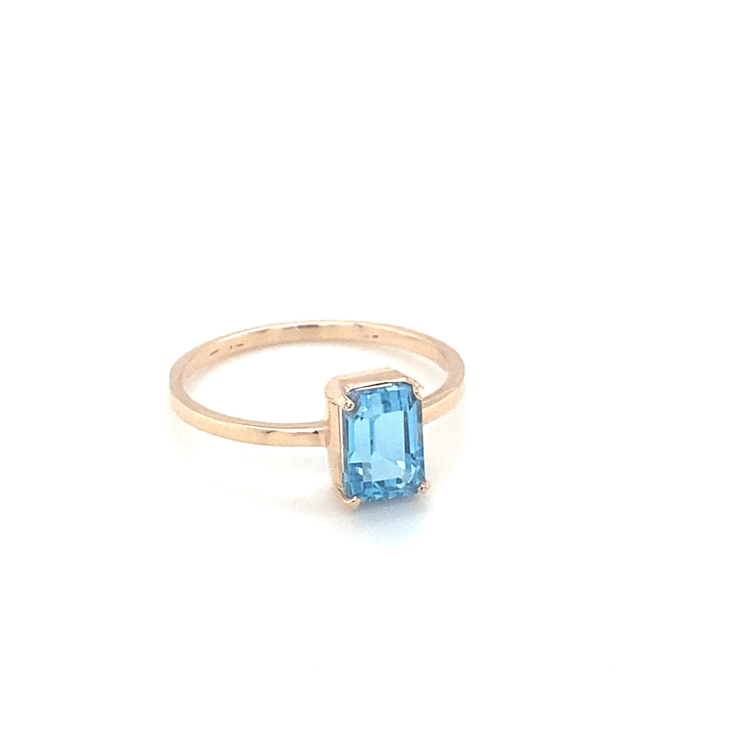 Baguette cut blue topaz is mounted in 14K yellow gold. Beautifully hand crafted ring in a simple design is suitable for your everyday companion. Carefully chosen gem stone is hand cut and polished. One of a kind ring to suit your style. Its sleek