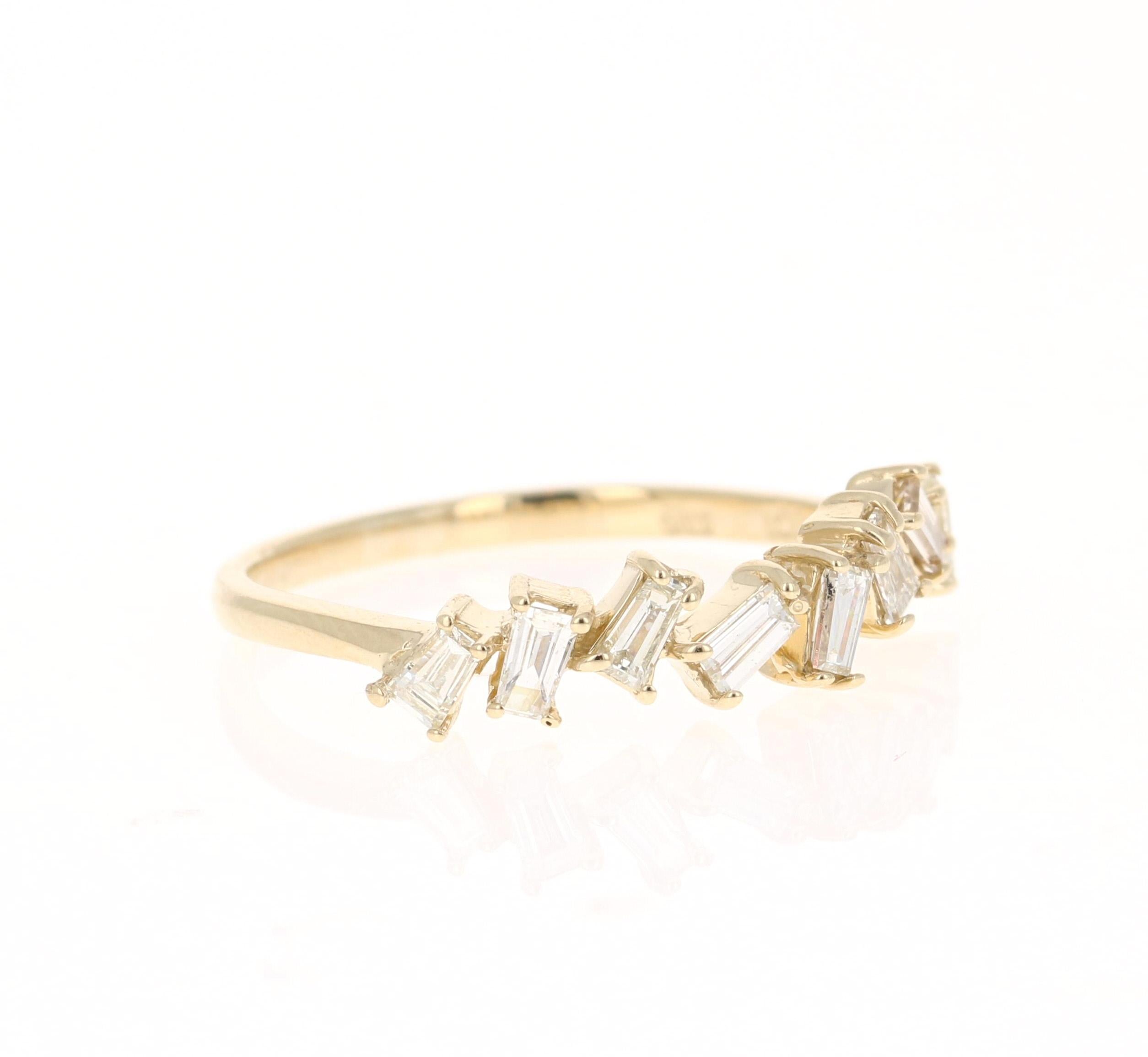 Unique and cute band that can be worn as a single band or stack with other bands in other colors of Gold! 

This ring has 8 Baguette Cut Diamonds that weigh 0.52 Carats. 

Crafted in 14 Karat Yellow Gold is 1.9 grams 

The ring is a size 7 and can