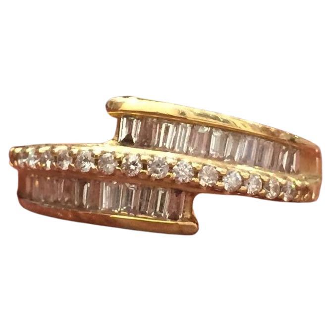 Gold and Diamond Cocktail/Dress Ring 

Set with Baguette and Round brilliant cut diamonds of 1.25ct in total approx., of good colour and clarity 

18K Yellow Gold

Total item's weight: 5.2gr. 

Ring's size: N (can be re-sized)

Comes with box and
