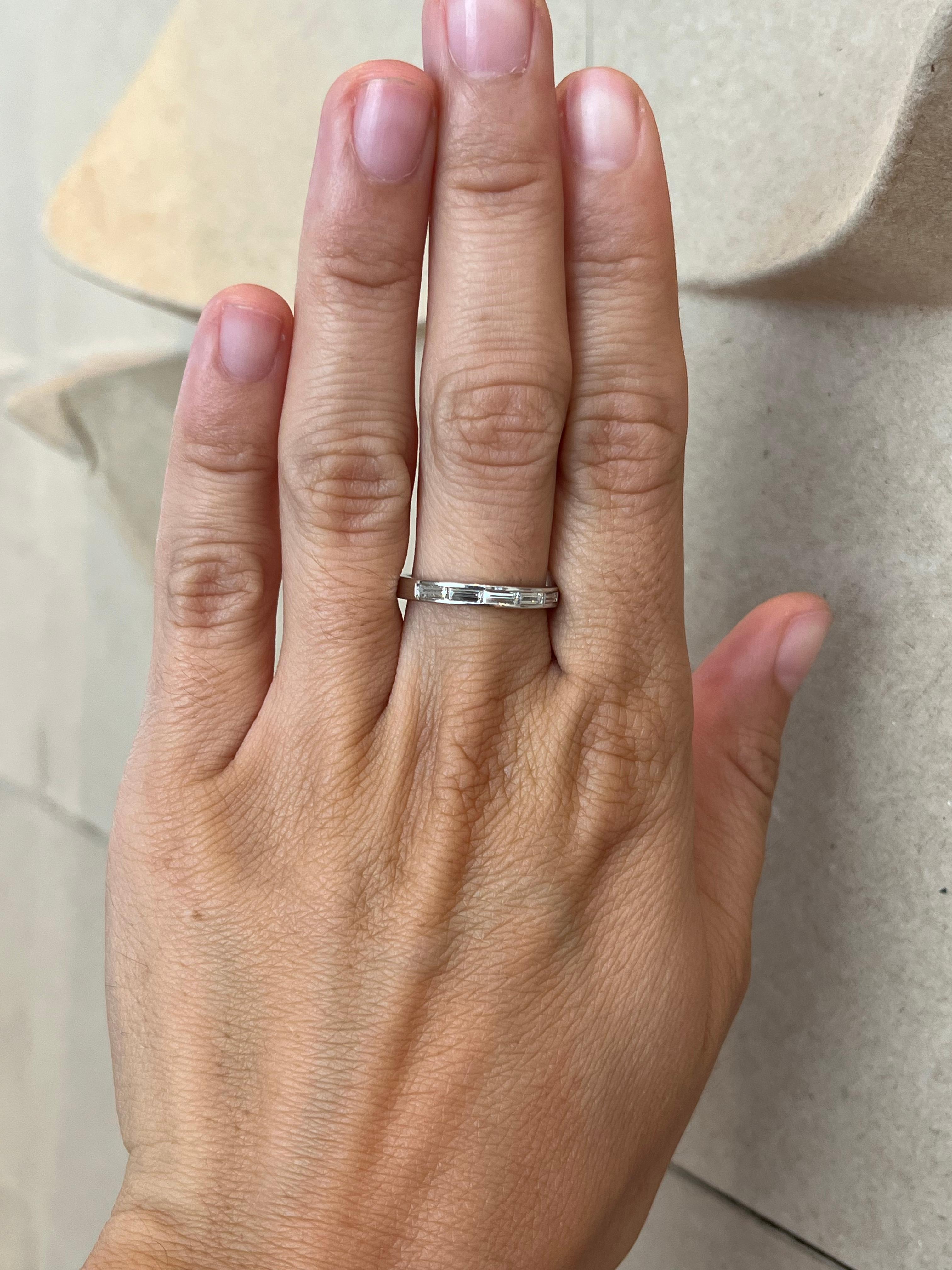 Crafted by Bracken Jewelers in Santa Monica, California. Five baguette cut natural diamonds are channel set sideways in this half eternity platinum wedding band for a classic, sleek look.

- 2.5mm width
- Five baguette cut natural diamonds total