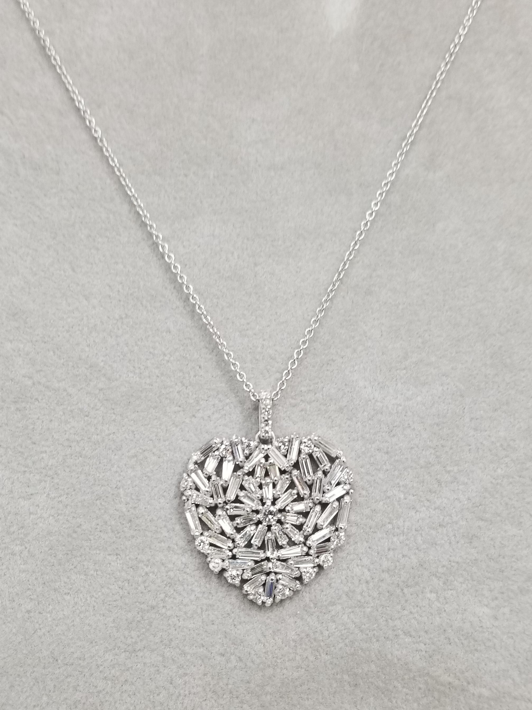 Beautiful baguette and round diamond heart set in 14k white gold.
Specifications:
    main stone: BAGUETTE CUT DIAMONDS
    diamonds: 52 PCS
    carat total weight: 2.35cts.
    color: G
    clarity: VS2-SI1
    second: ROUND CUT DIAMONDS
   