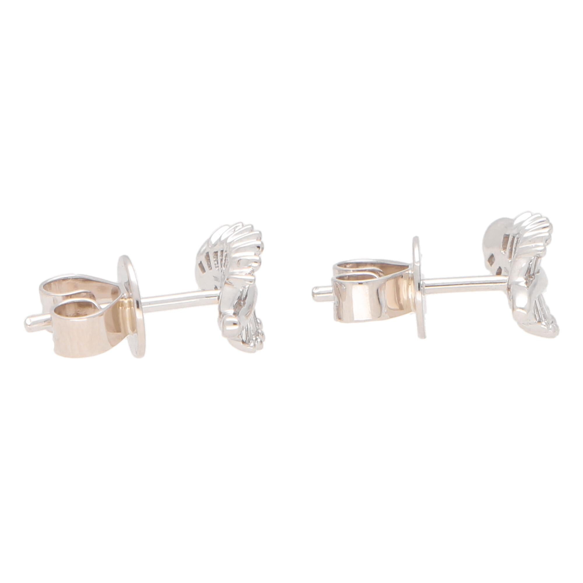  A lovely little pair of diamond leaf stud earrings set in 18k white gold.

These beautiful little studs are each individually set with 13 tapered baguette cut diamonds claw set to depict the grooves of a natural leaf. Due to the design these studs