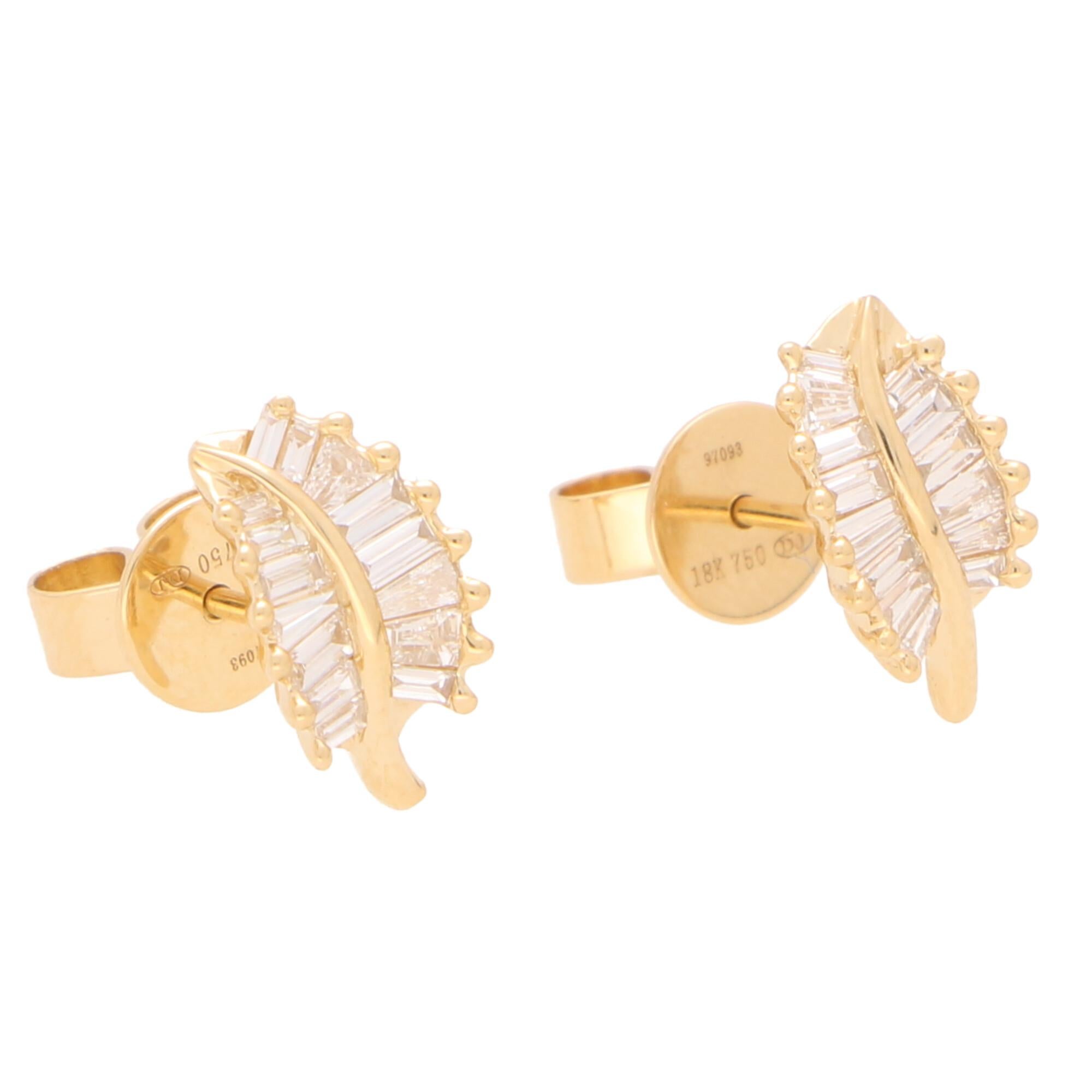 A lovely little pair of diamond leaf stud earrings set in 18k rose gold.

These beautiful little studs are each individually set with 13 tapered baguette cut diamonds claw set to depict the grooves of a natural leaf. Due to the design these studs