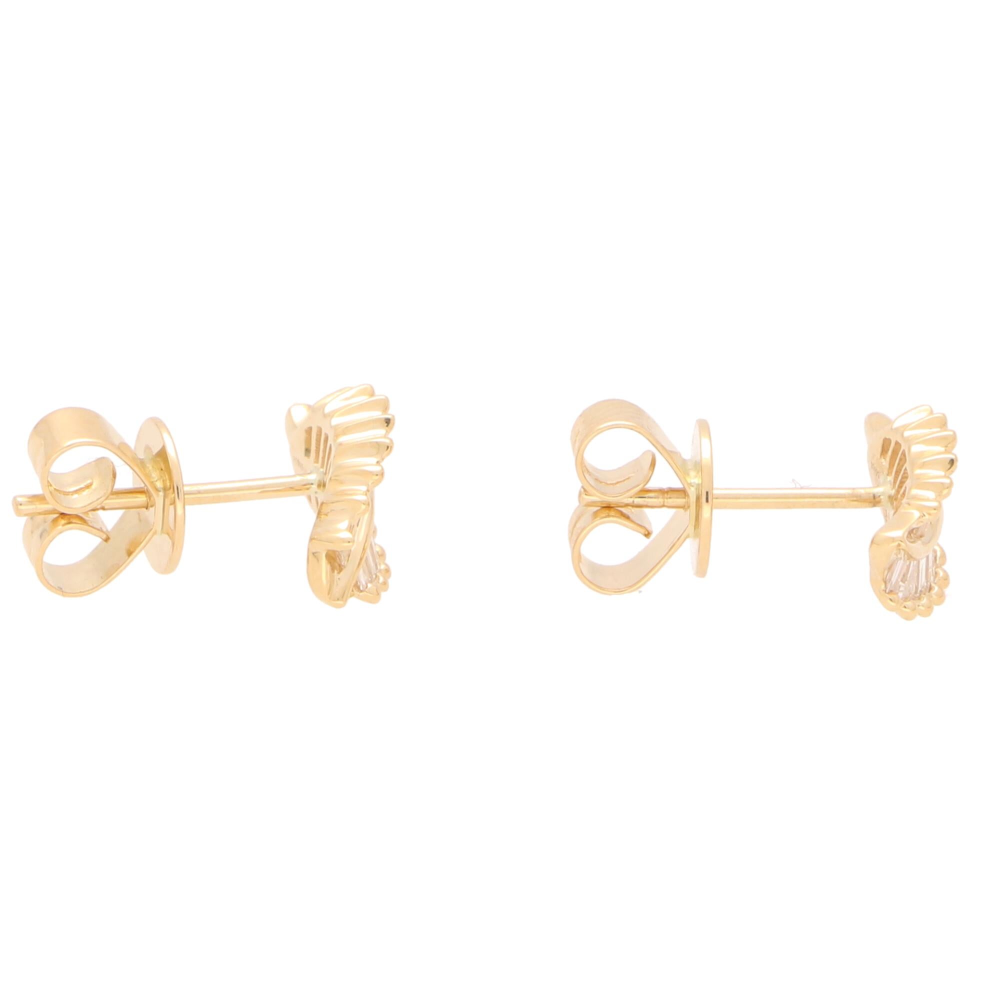 Modern Baguette Cut Diamond Leaf Stud Earrings Set in 18 Karat Yellow Gold For Sale