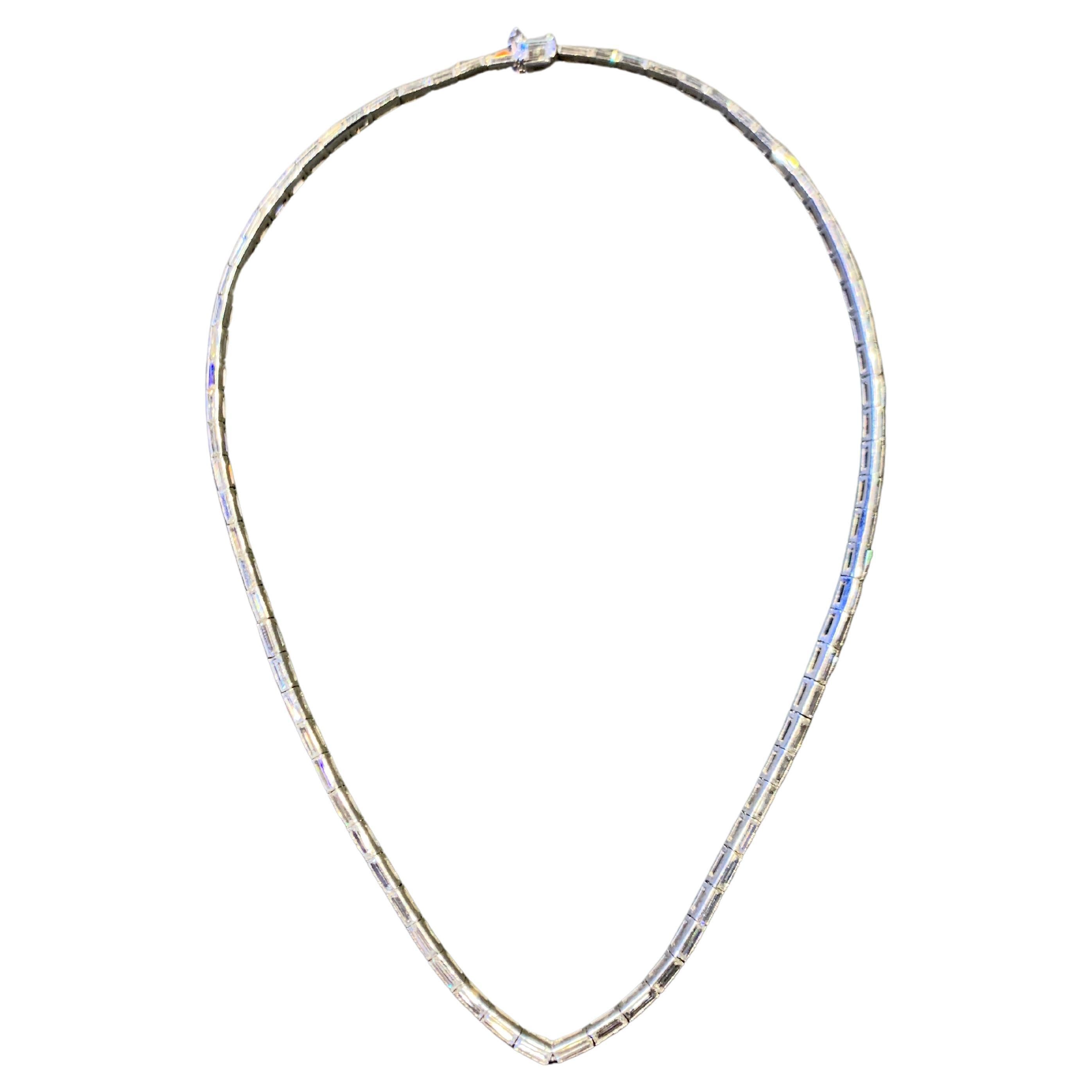 Baguette Cut Diamond Necklace

A platinum necklace set with 72 baguette cut diamonds and 1 emerald cut diamond

Total Approximate Diamond Weight: 7.0 carats

Length: 15.75