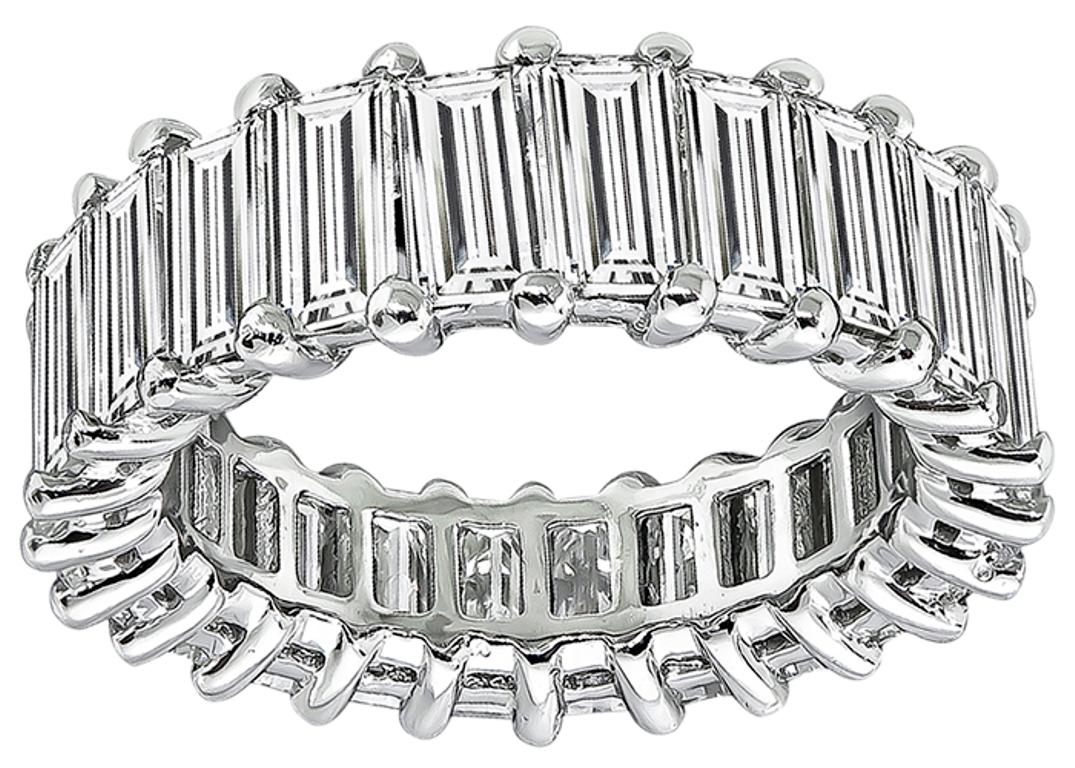 This stunning platinum eternity wedding band is set with sparkling baguette cut diamonds that weigh 8.50ct. graded H color with VS clarity. The band measures 7mm in width and weighs 7 grams. 
It is size 6 1/2.
Inventory #48448BKRB