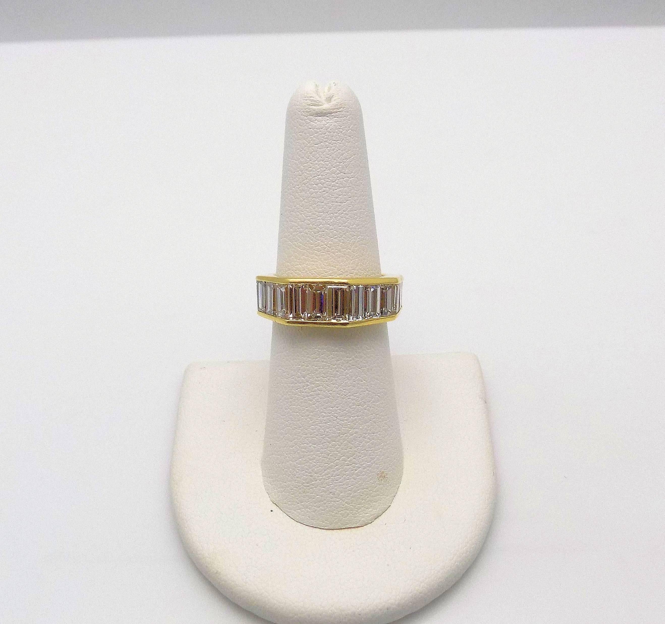 Impressive 18 Karat Yellow Gold Wedding Band, Tapered, Hexagonal Shape Featuring 22 Baguette Cut Diamonds 7.00 Carat Total Weight VS, H-I. Ring Size/Finger Size 7; 4.5 DWT or 7.00 Grams.