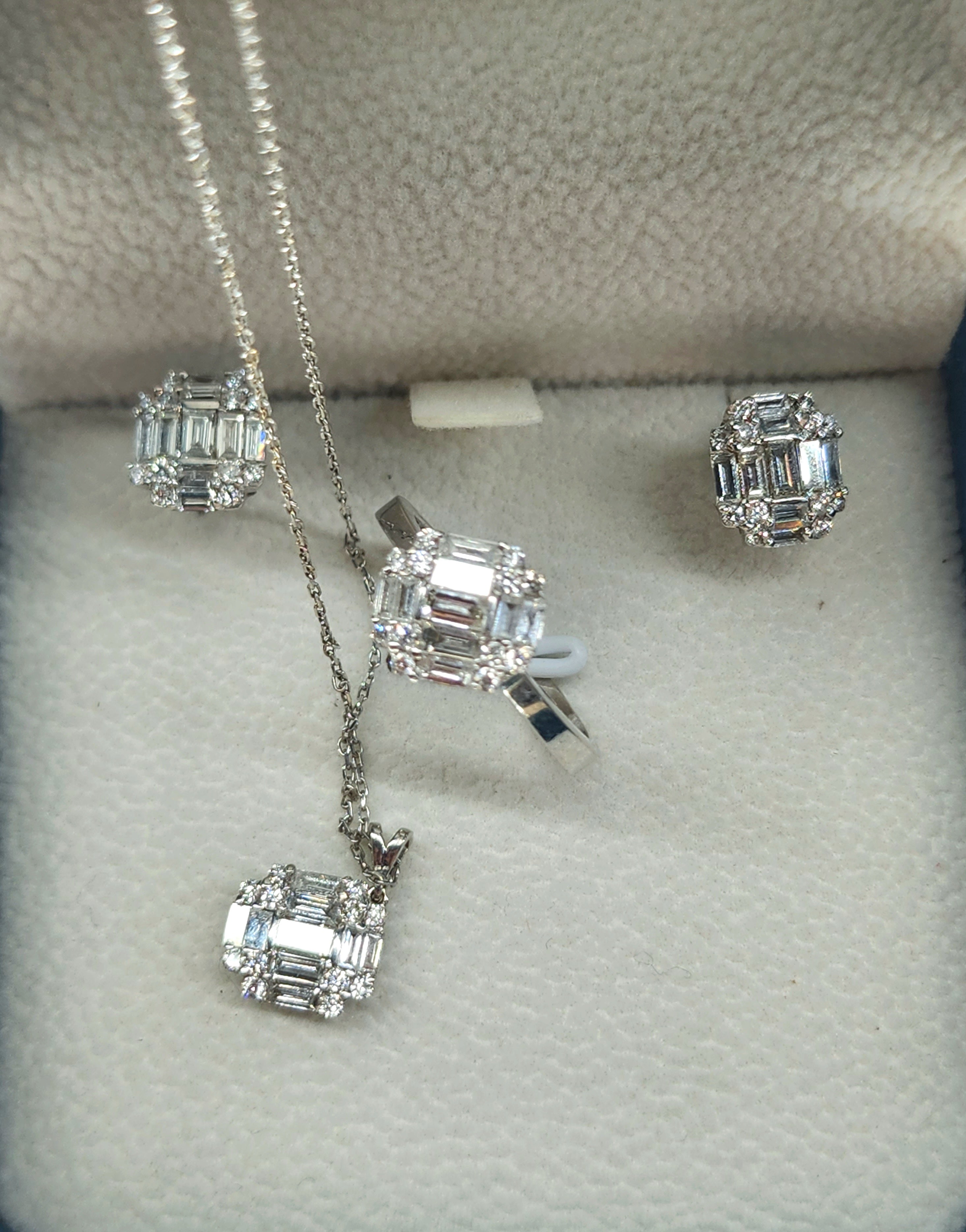 18k white gold set of ring pendant and earrings including a chain with brilliant baguette cut diamonds estimate weight 2.80 carats H color white vs1 clearity hall marked 750 gold standard 