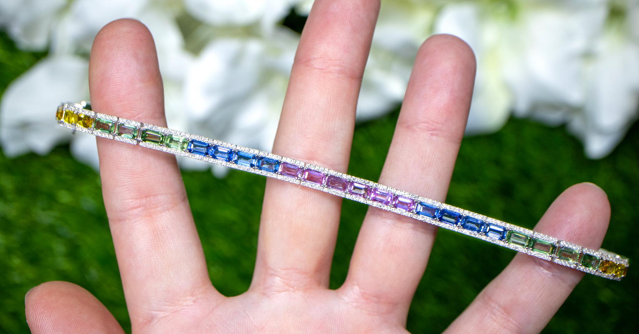 It comes with the Gemological Appraisal by GIA GG/AJP
All Gemstones are Natural
Multicolor Sapphires = 11.12 Carats
Diamonds = 1.58 Carats
Metal: 18K White Gold
Length: 7.1 Inches
Width: 0.2 Inches