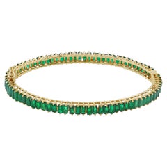 Hochzeitsarmreif aus 14-karätigem Gelbgold mit einem natürlichen Smaragd im Baguette-Schliff – edler Schmuck