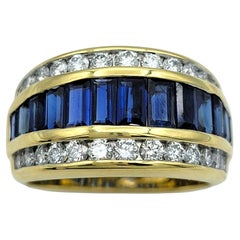 Anillo multifila de zafiro talla baguette y diamante redondo en oro de 18 quilates