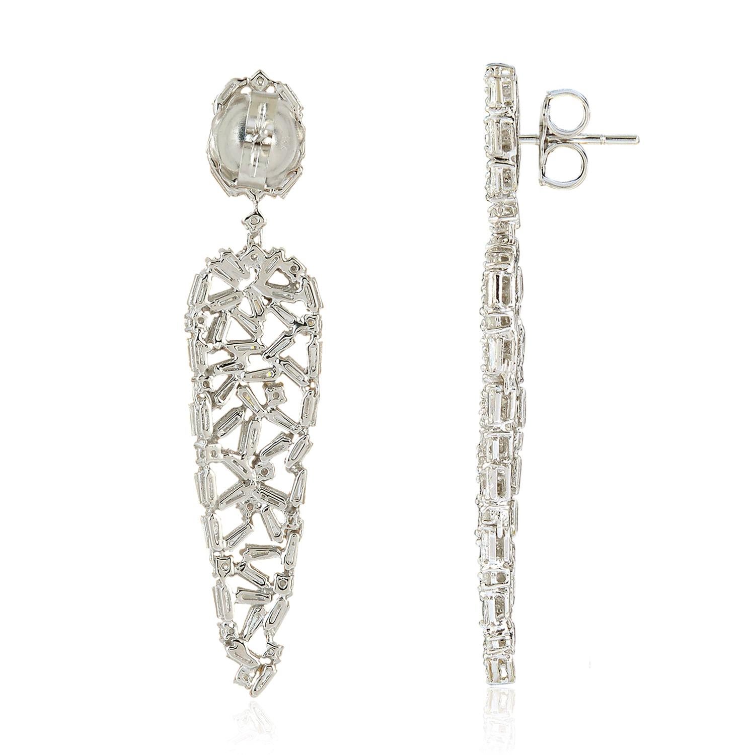 Handcrafted from 18-karat gold, these beautiful drop earrings are set with 5.16 carats of glimmering baguette cut diamonds. 

FOLLOW  MEGHNA JEWELS storefront to view the latest collection & exclusive pieces.  Meghna Jewels is proudly rated as a Top