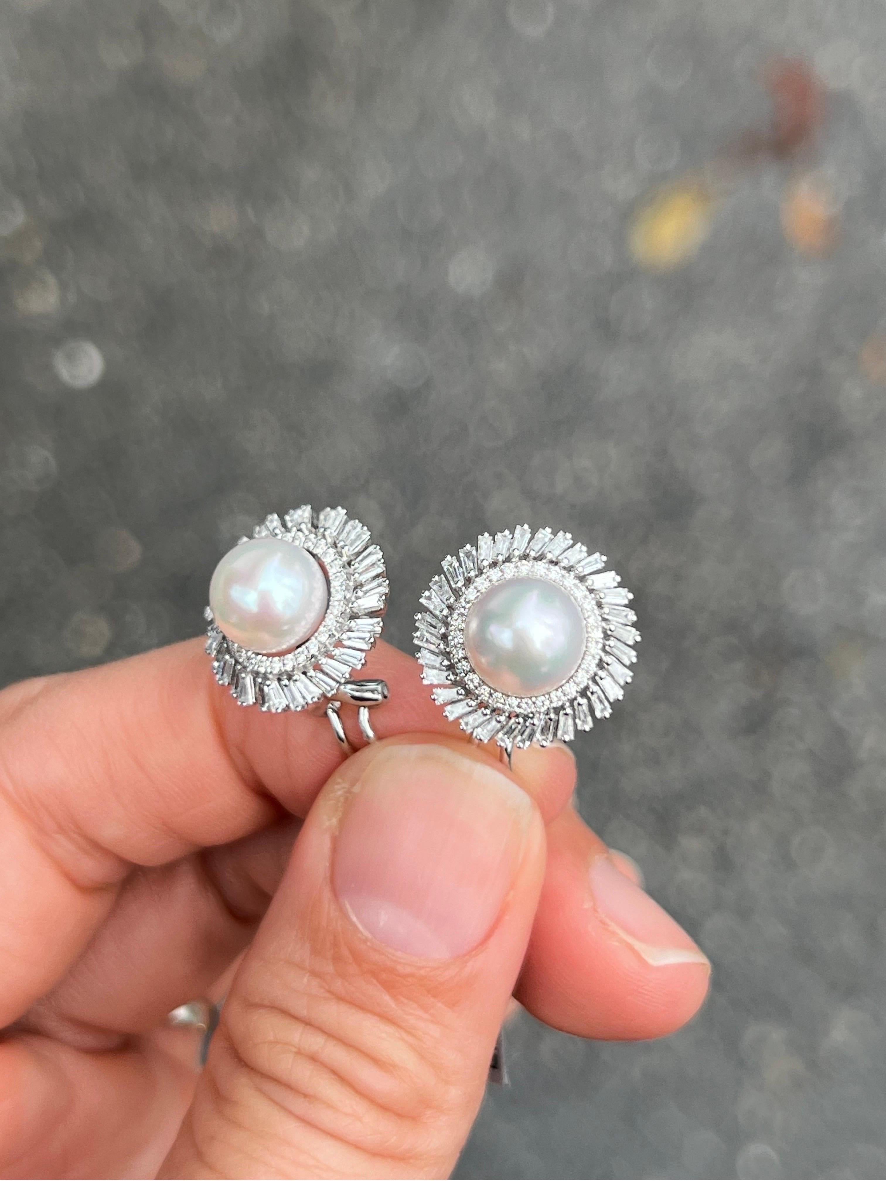 These 18k white gold and baguette diamond earring is a stunning piece that is sure to make a statement. The earrings feature 2 lustrous freshwater pearls.The pearls measure a modest 8mm in size making them a beautiful, not too voluminous size for a