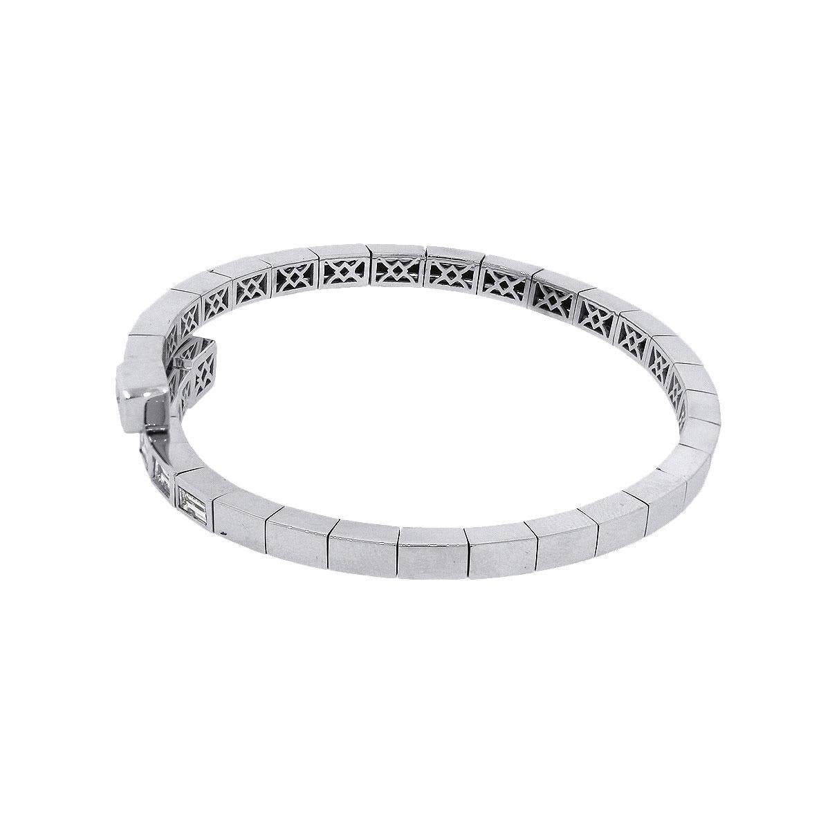 Style: Baguette Diamond Crossover Bangle
Material: 14k white gold
Diamond Details: Approximately 3.12ctw of round brilliant diamonds. Diamonds are G/H in color and SI in clarity.
Total Weight: 22.4g (14.4dwt)
Bracelet Measurements: inside