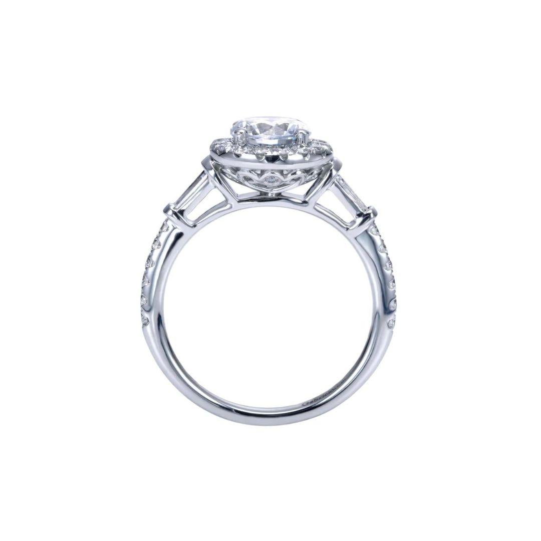Ladies' 14k White Gold Diamond Engagement Mounting. Diamond pave on each side of the ring ascends to an elegant tapered baguette leading to the center stone. Center diamond NOT included. Side diamonds are 0.60 ctw, H color, SI clarity. Mounting