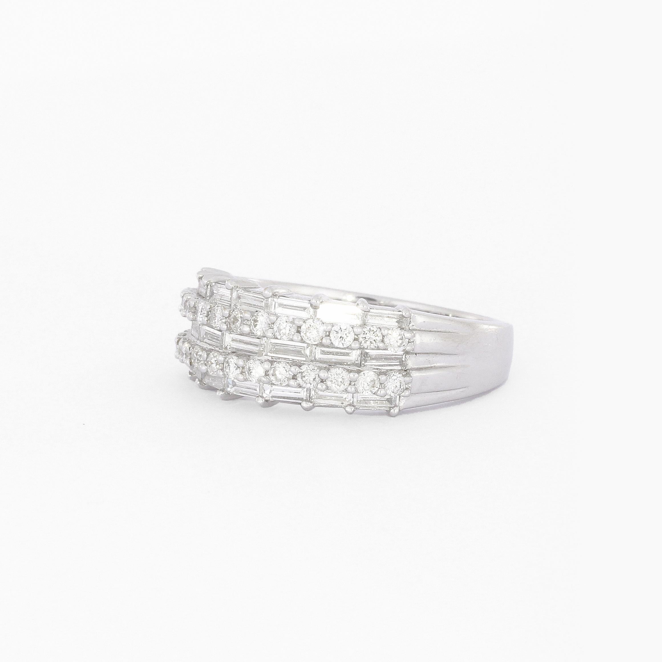 Baguette Diamond Half Eternity Ring In 18k White Gold
21 Baguette Cut + 28 Brilliant Cut Diamonds approx. 0.8ct.
