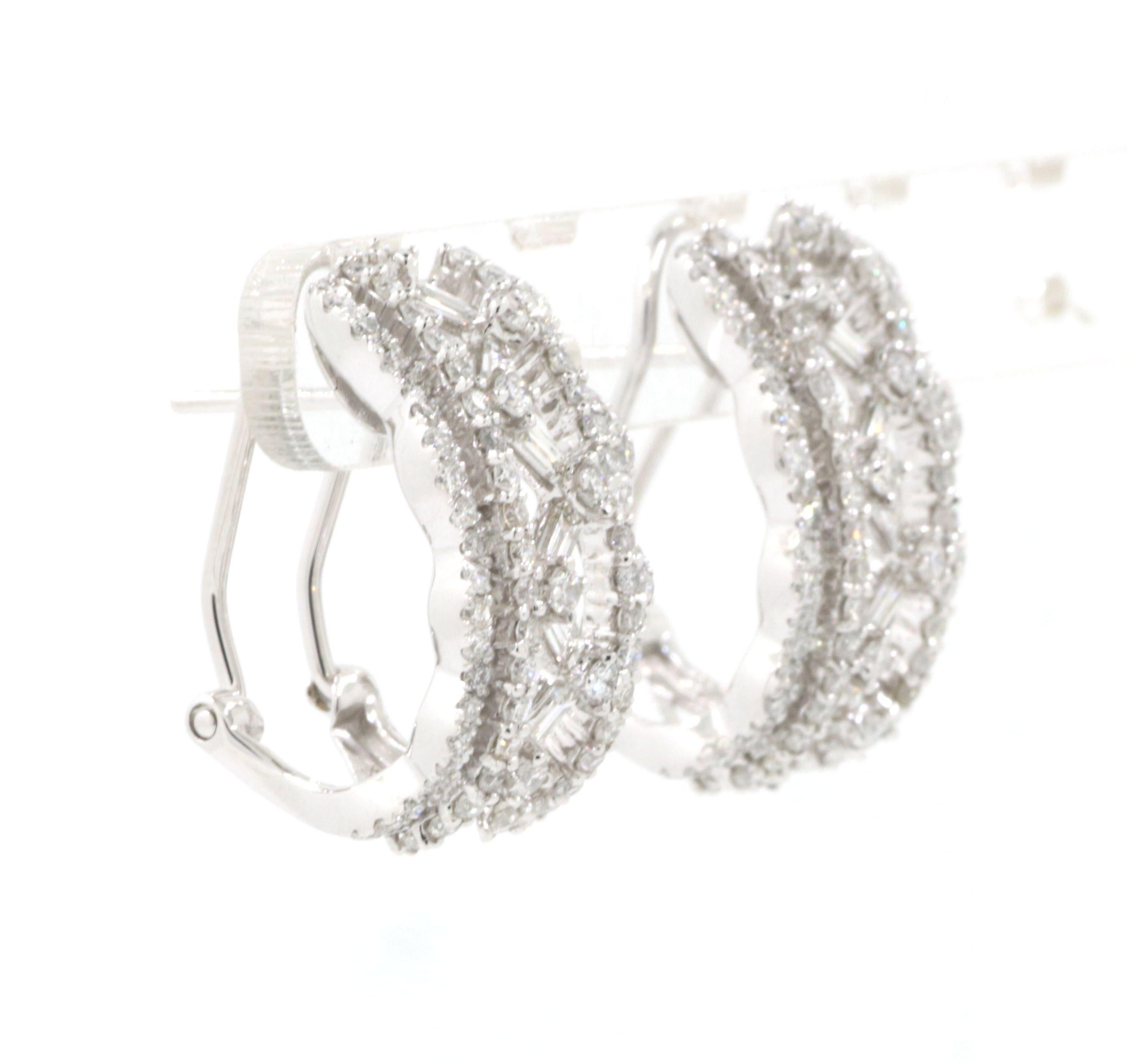 These stunning earrings exude sophistication, meticulously crafted from 18K white gold. The design showcases a captivating interplay of shapes and light, featuring both baguette and round cut diamonds.

The baguette diamonds, totaling 0.41 carats,