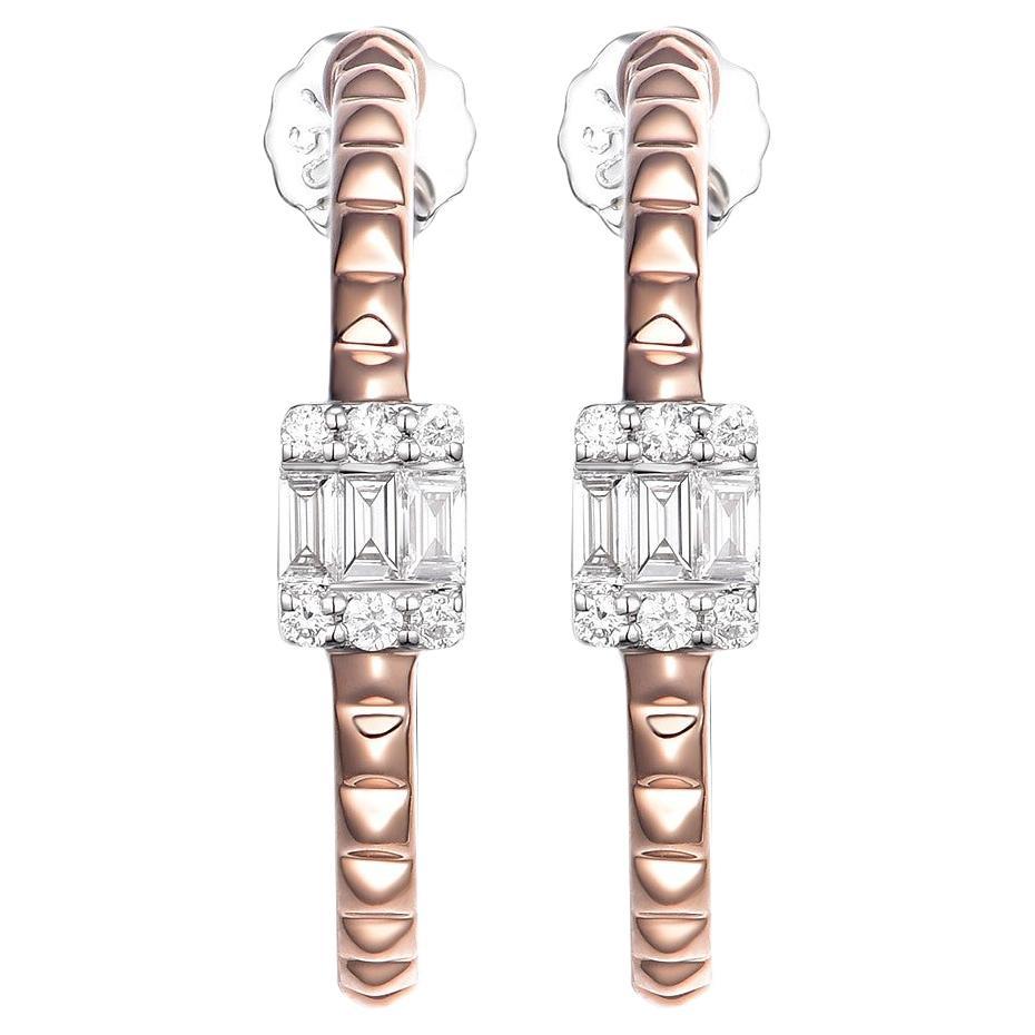 These stunning earrings showcase a captivating design that exudes elegance and modern sophistication. Crafted in 18 karat rose gold.

The centerpiece of each earring consists of 3 baguette diamonds, totaling 0.17 carat, arranged in a sleek and