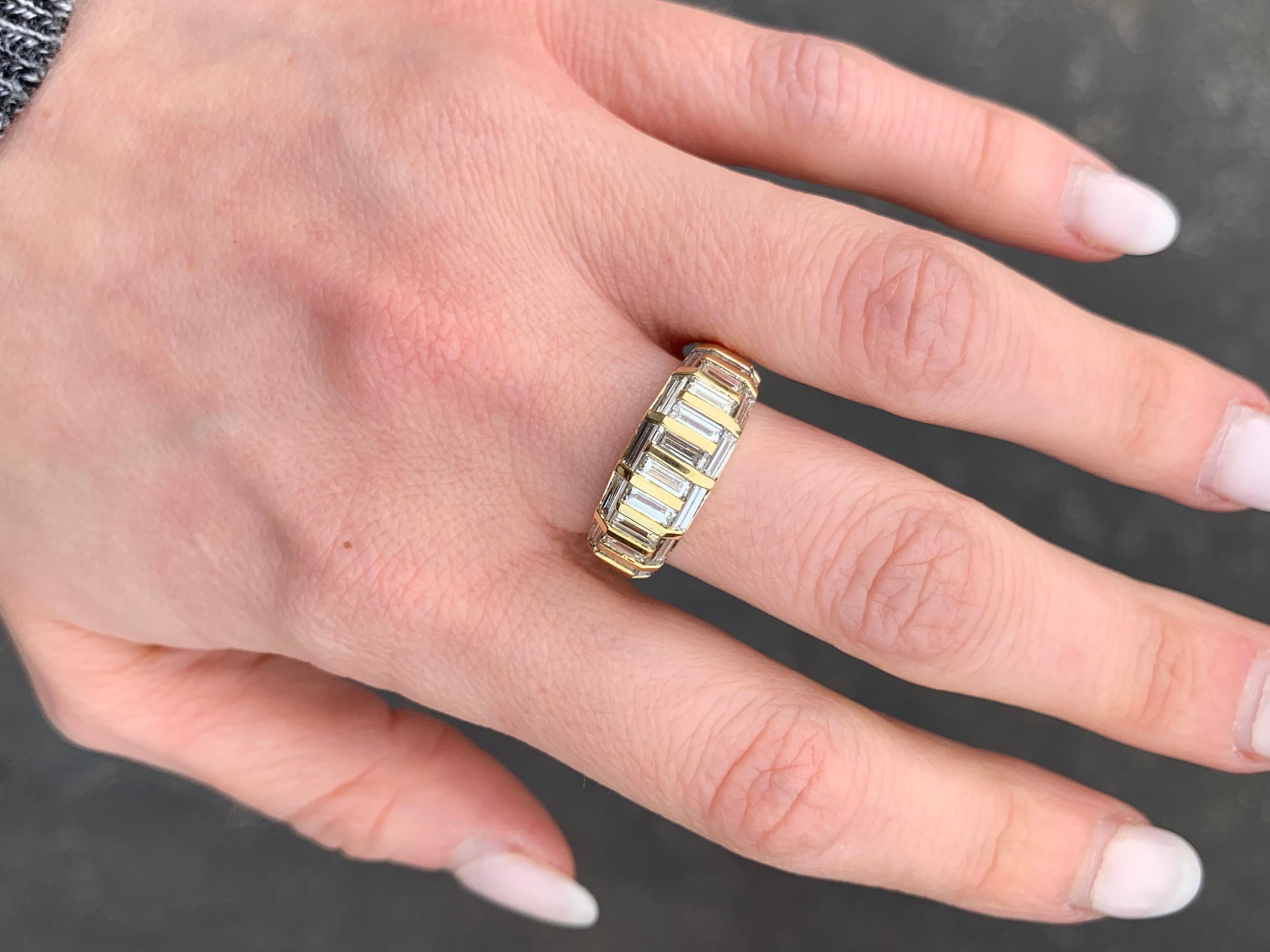 Twenty-two baguette cut diamonds are artfully arranged in a mosaic pattern with polished 18k gold gold bars further accenting the surface. Ring has a total diamond carat weight of 2.10 carats at approximately H color, VS2 clarity. Width of ring