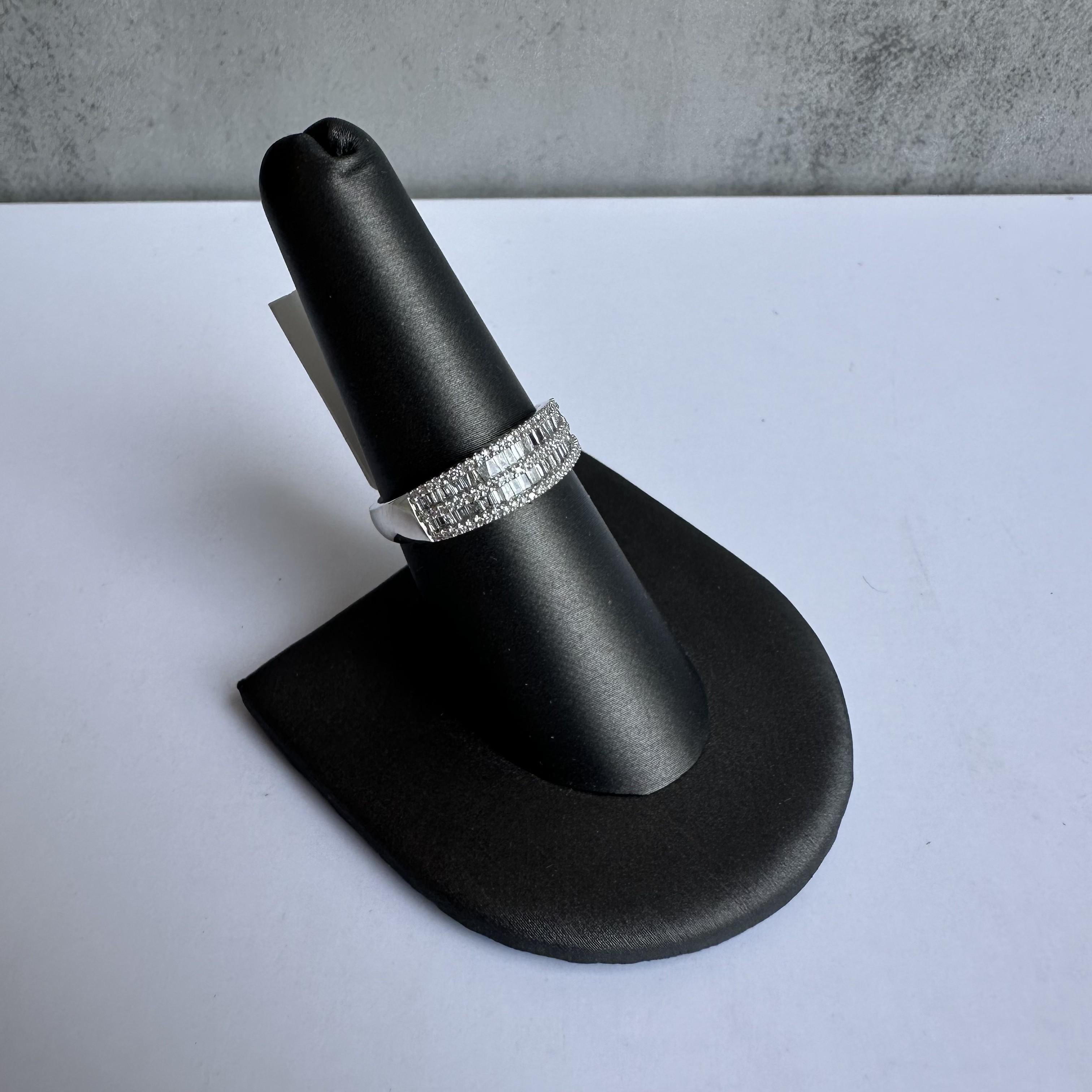 Enhance your jewelry collection with this exquisite Baguette Diamond Ring in 10kt White Gold. Featuring 0.50 carats of GH SI-I1 natural baguette cut and round single cut diamonds, this ring combines timeless beauty with modern elegance, perfect for