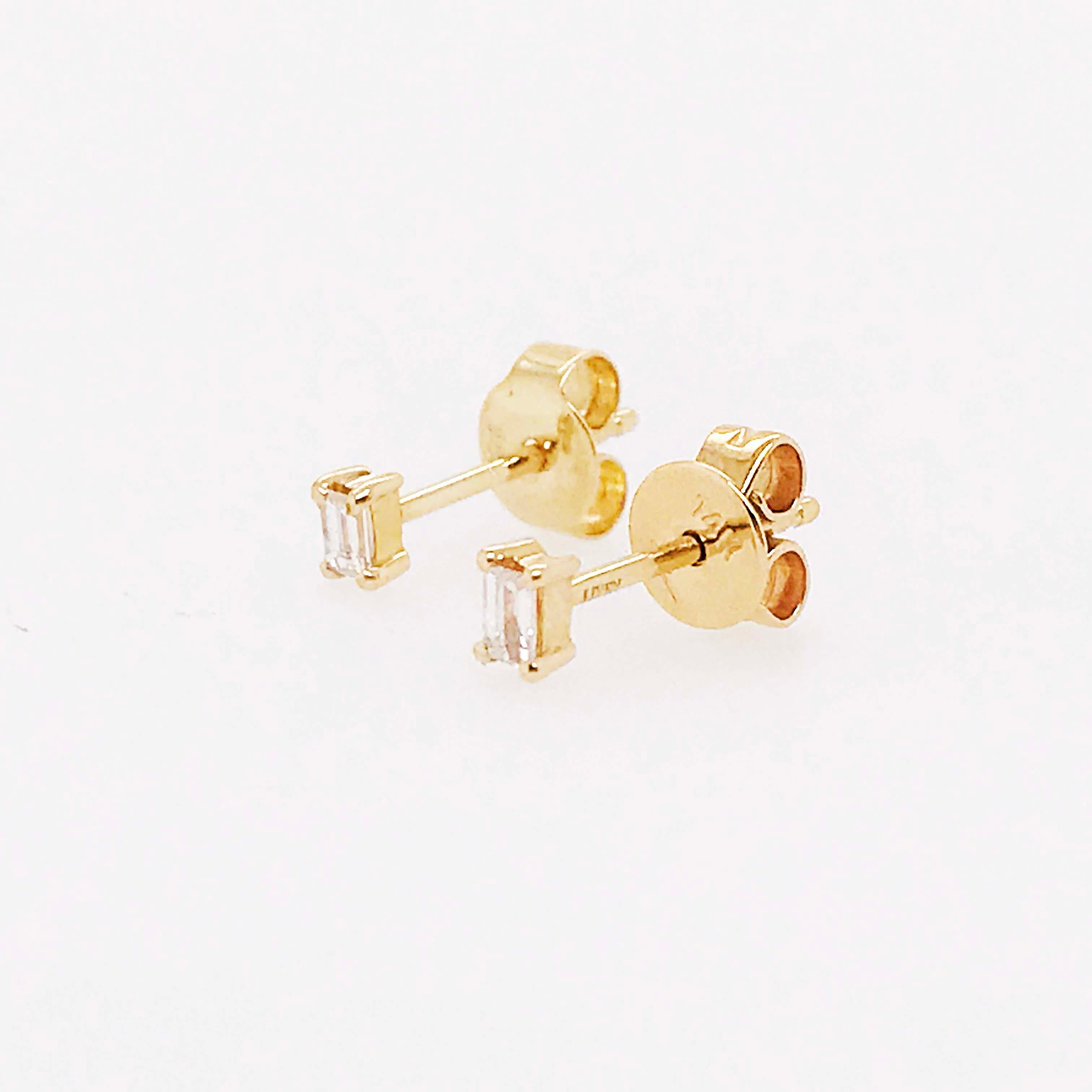 These straight baguette diamond solitaire earring studs are the perfect everyday studs! With a genuine baguette shaped diamond set in a four prong solitaire setting in the earring. The earrings are 14k yellow gold. Diamond stud earrings are a staple