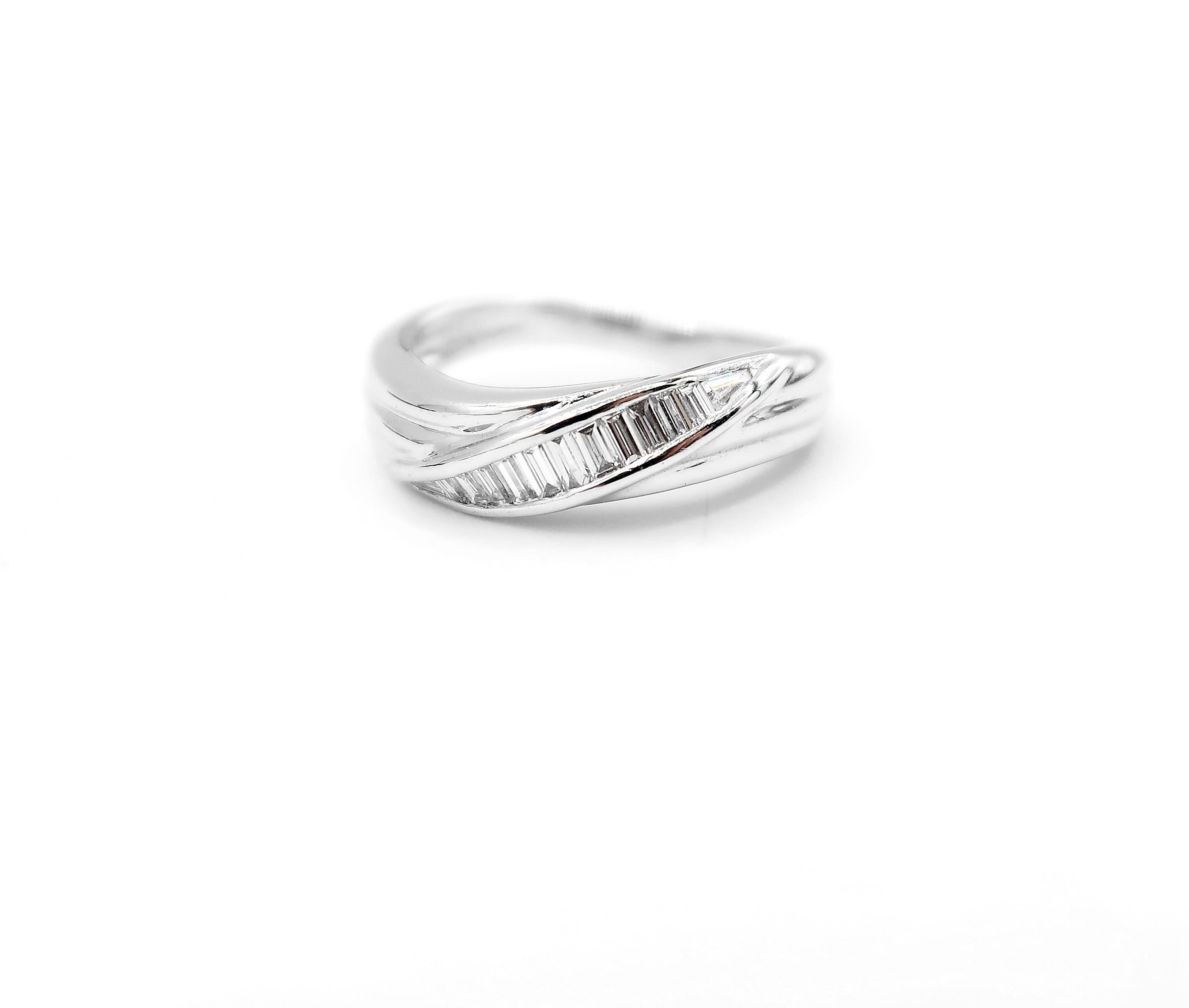 Baguette Diamond Wave Fluted 18 Karat White Gold Band Ring

Please let us know upon checkout should you wish to have the ring resized. 
Ring size: UK I, US 4.5

Gold: 18K 4.158g.
Diamond: 0.48ct.