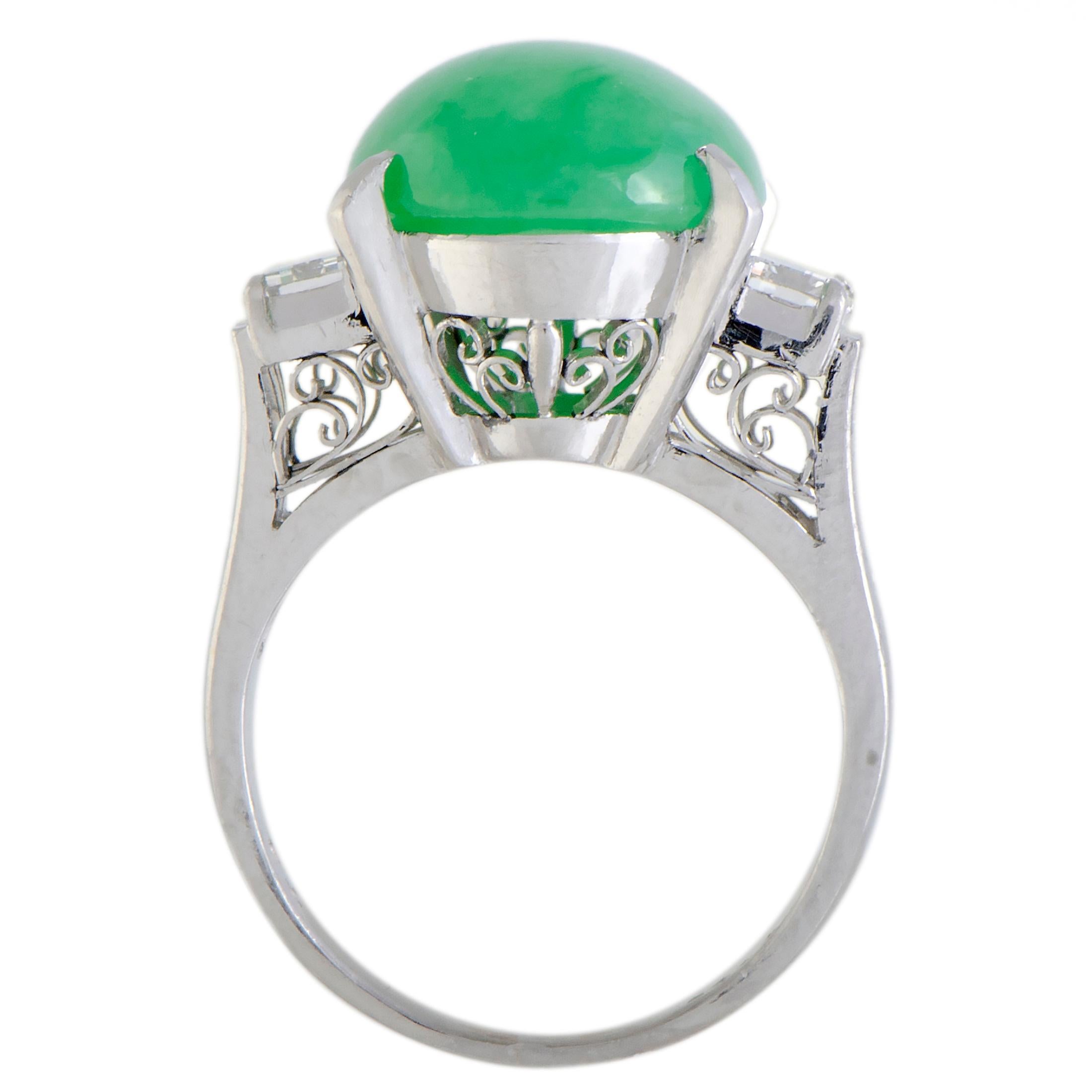 Given a compelling pop of color by the exquisitely cut green jade, this fabulous ring offers a look that is both incredibly fashionable and splendidly luxurious. The ring is made of elegant platinum and boasts a total of 0.74 carats of diamonds,