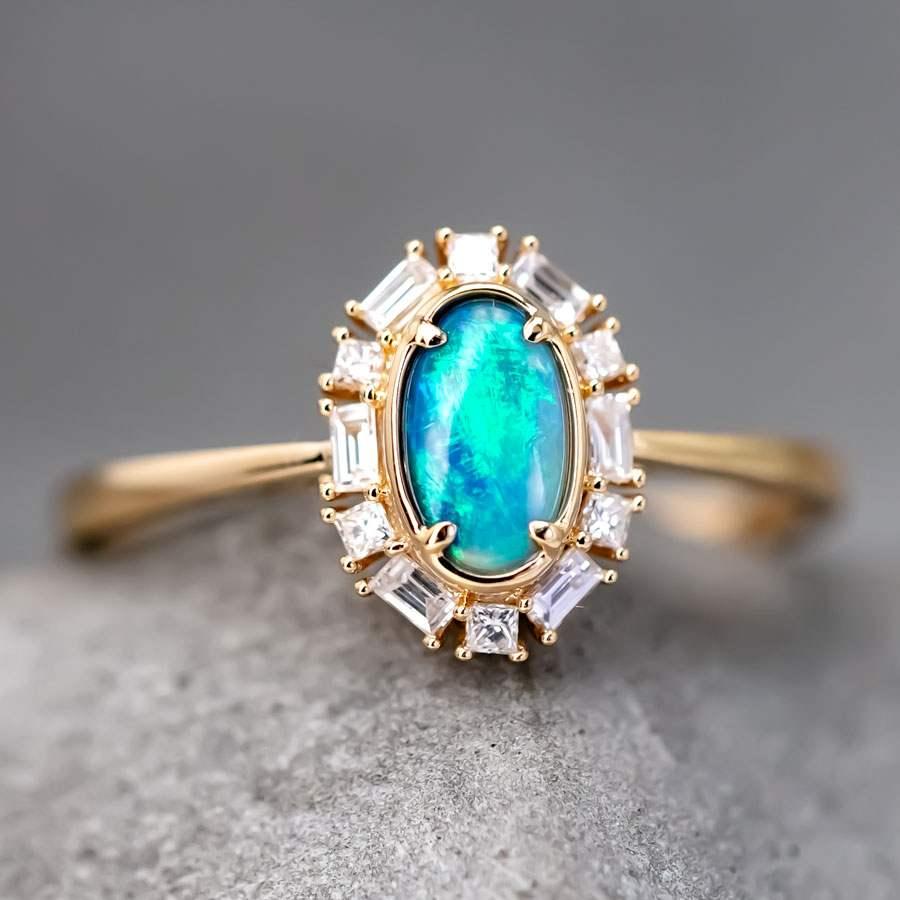 Baguette Halo Diamante Australiano Ópalo Negro Alianza de Boda Oro Amarillo 18K.


Envío nacional gratuito USPS First Class ¡Bolsa o caja de regalo gratis con cada pedido!

El ópalo, la reina de las piedras preciosas, es una de las más bellas del