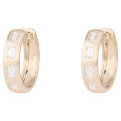 Boucles d'oreilles créoles « huggie » en or 14 carats avec diamant taille baguette de 0,55 ct