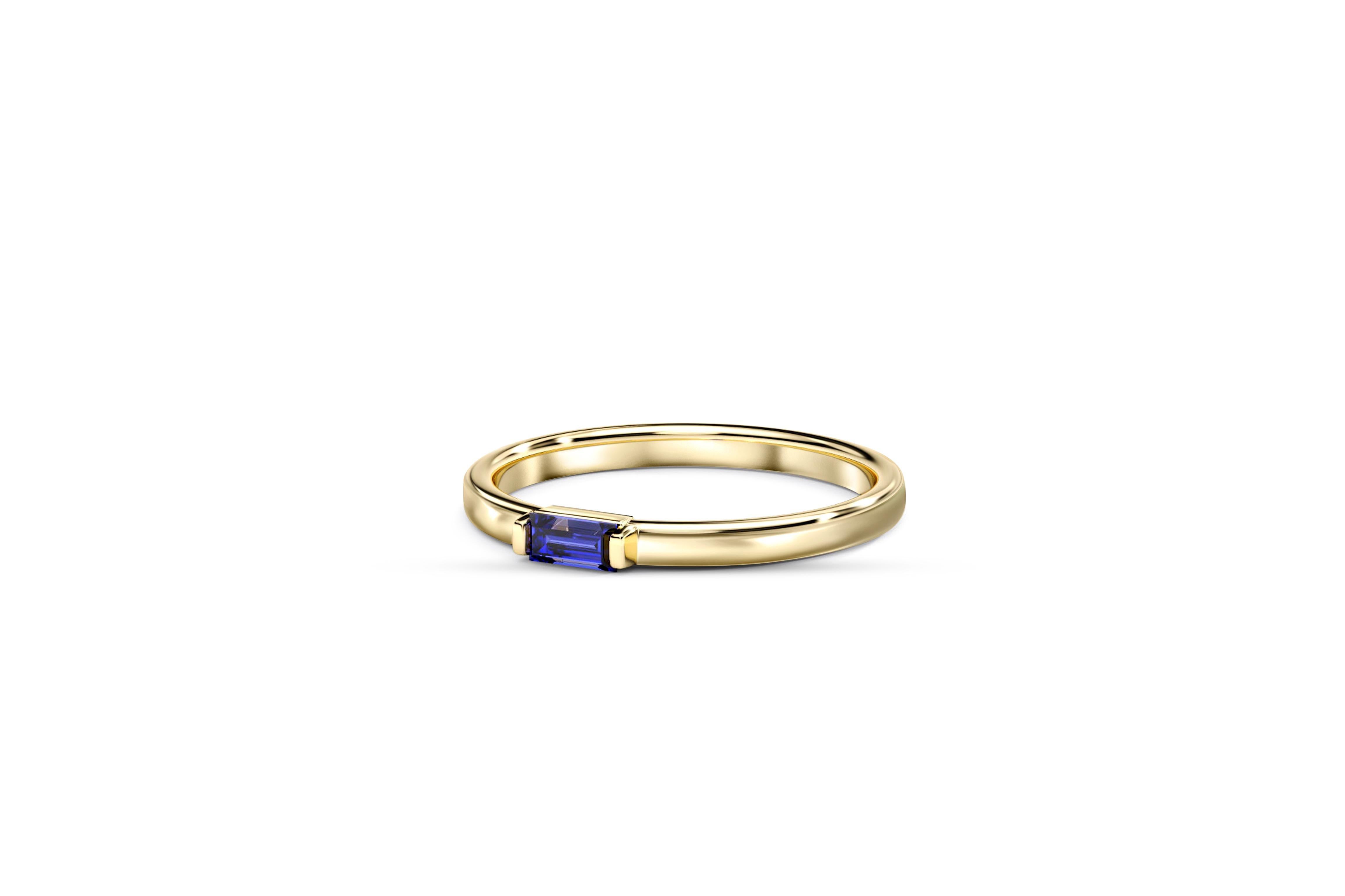 Modern Baguette lab sapphire 14k gold ring.