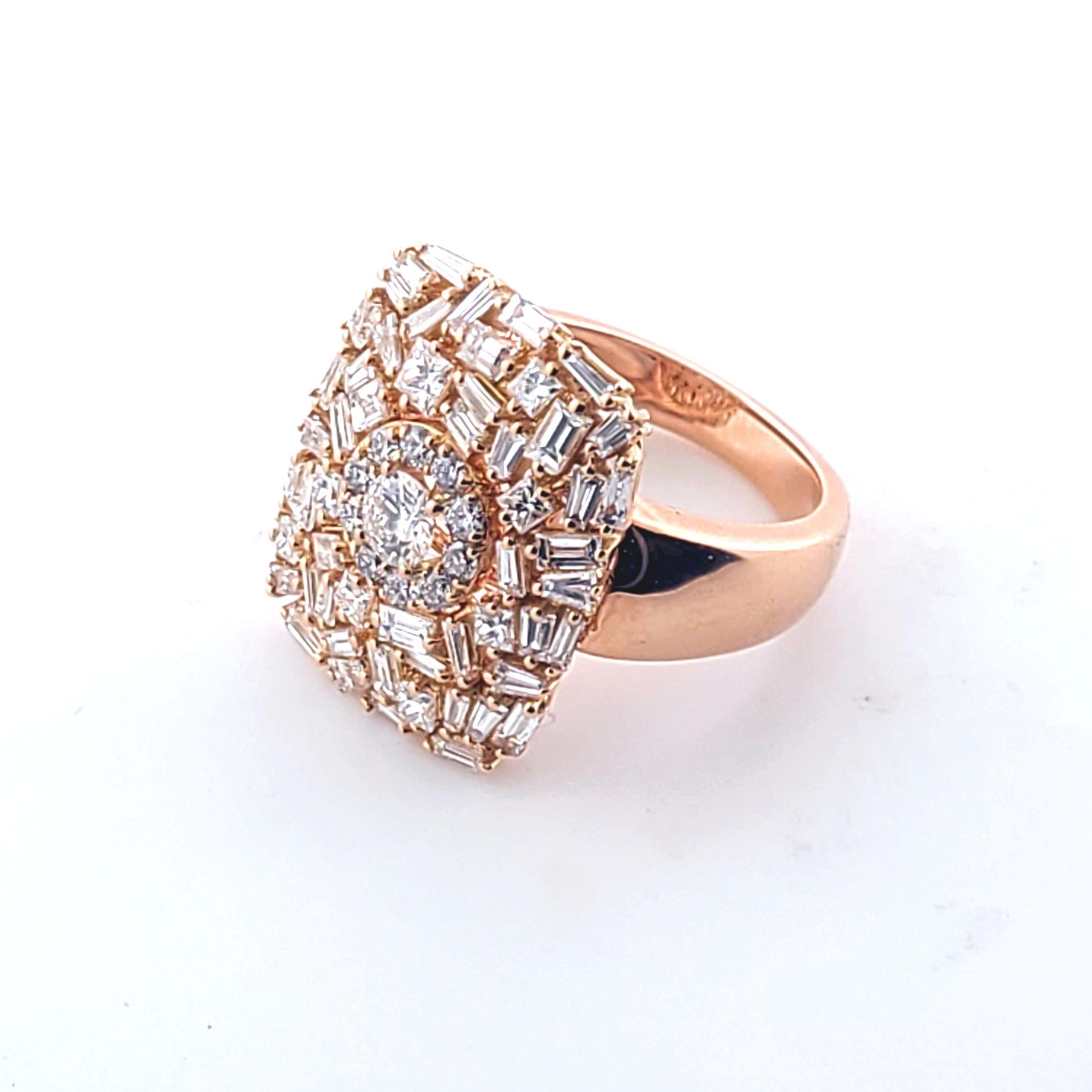 This 18k rose gold ring is has baguette, princess cut and round brilliant diamonds. The diamonds of which 1.25cts of baguettes, 0.38cts of princess cut and 0.50cts of round brilliant natural diamonds. The color and the clarity of the diamonds are