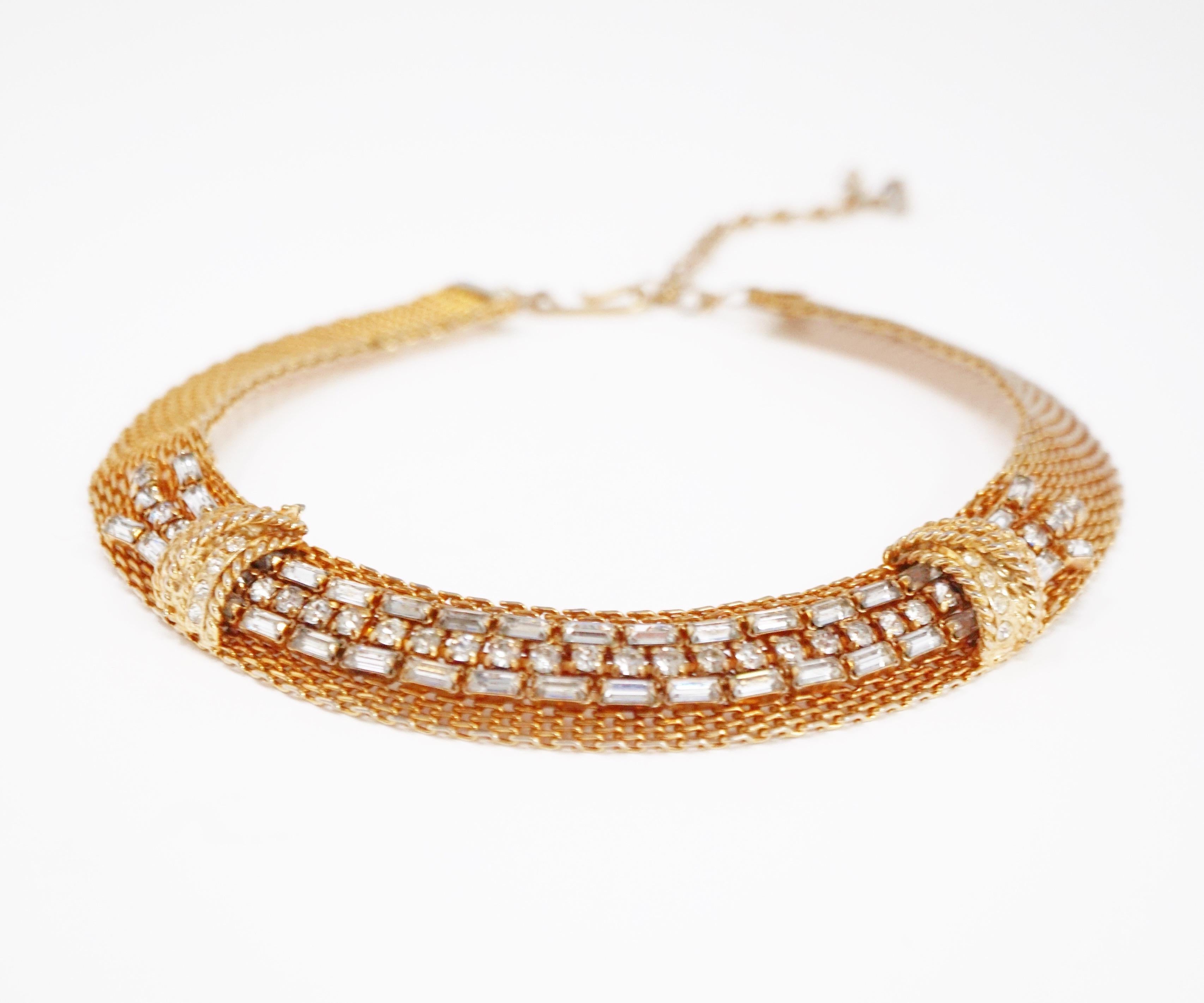 This gorgeous circa 1950s Jewels by Julio mesh choker necklace with rhinestone baguette accents is an extremely collectible piece of design history, with the 