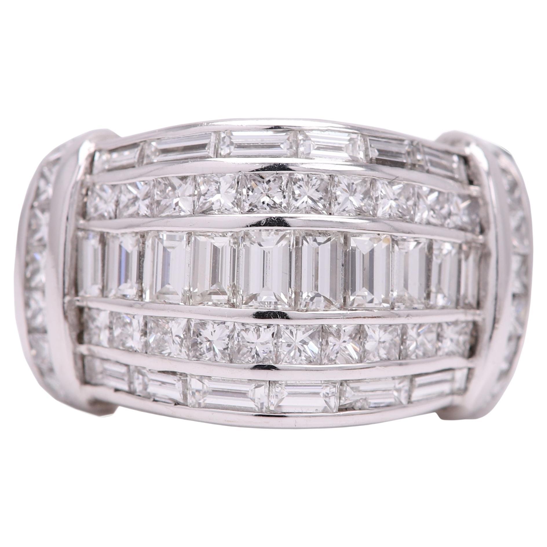 Cluster baguette ring
very impressive and statement
Total diamonds 3.37 carat  F-G -VVSI - VVS2
14k white gold 14.2 grams
finger size 6.75
the ring design dimension is about 14 mm at the widest and down to about 10 mm at the narrower area
it has mix