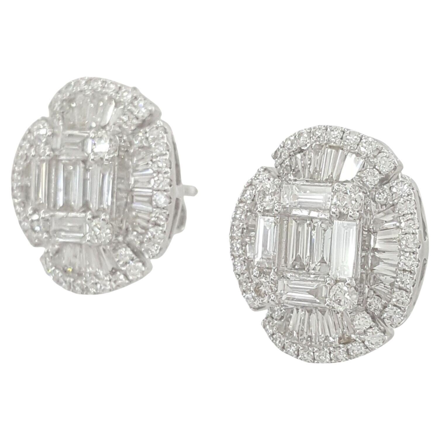 An exquisite pair of baguette and round brilliant cut diamond halo stud earrings.

 There are 12 Straight & 32 Tapered Natural Baguette Cut Diamonds weighing approximately 1.2 ct total weight, E-G in color and VVS-VS2 in clarity (most are VVS1-VS2)