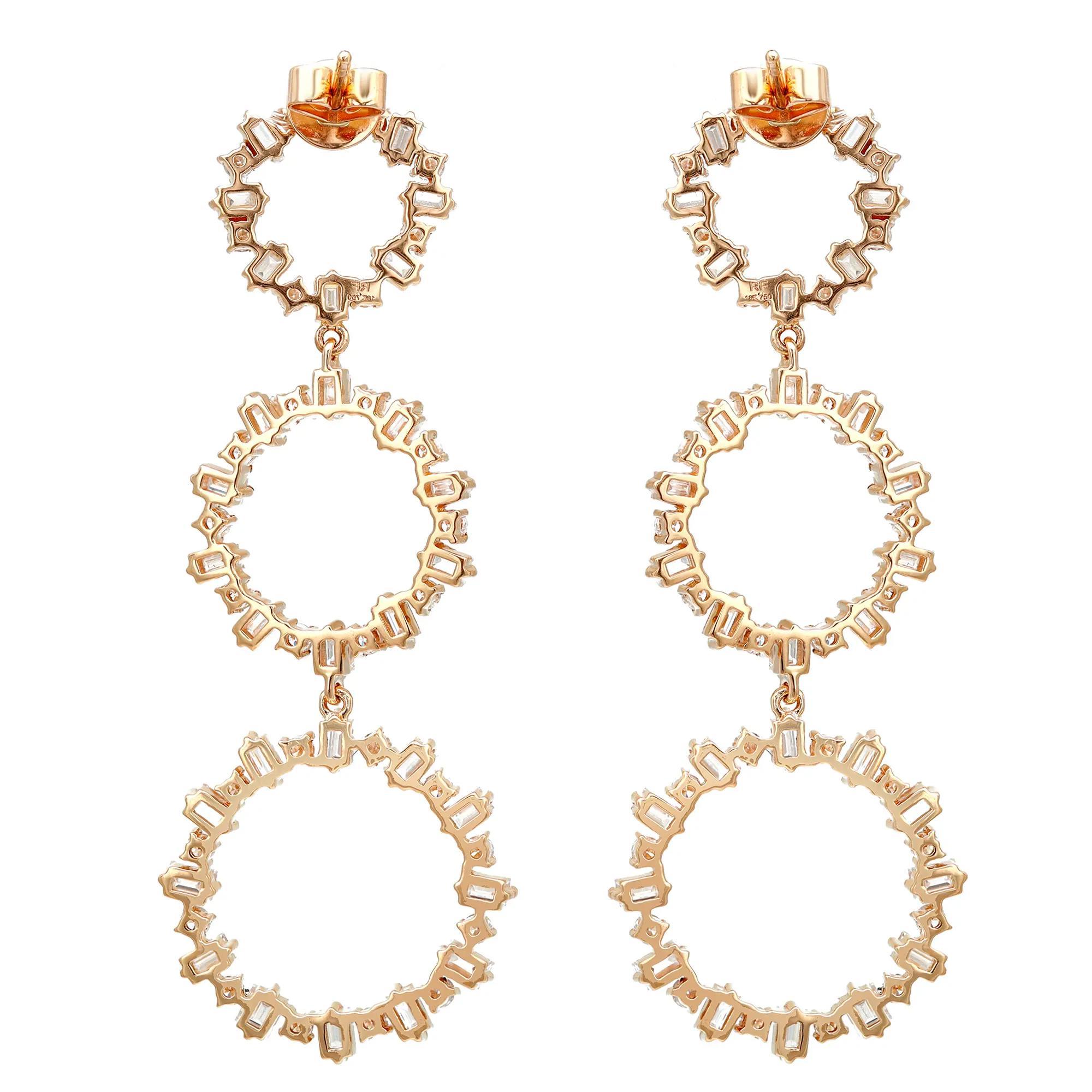 These exemplary dangle earrings mounted in 18k yellow gold add a touch of elegance and sophistication to any outfit. Featuring, prong set baguette and round cut diamonds encrusted in three graduating circles. Total diamond weight: 4.58 carats.