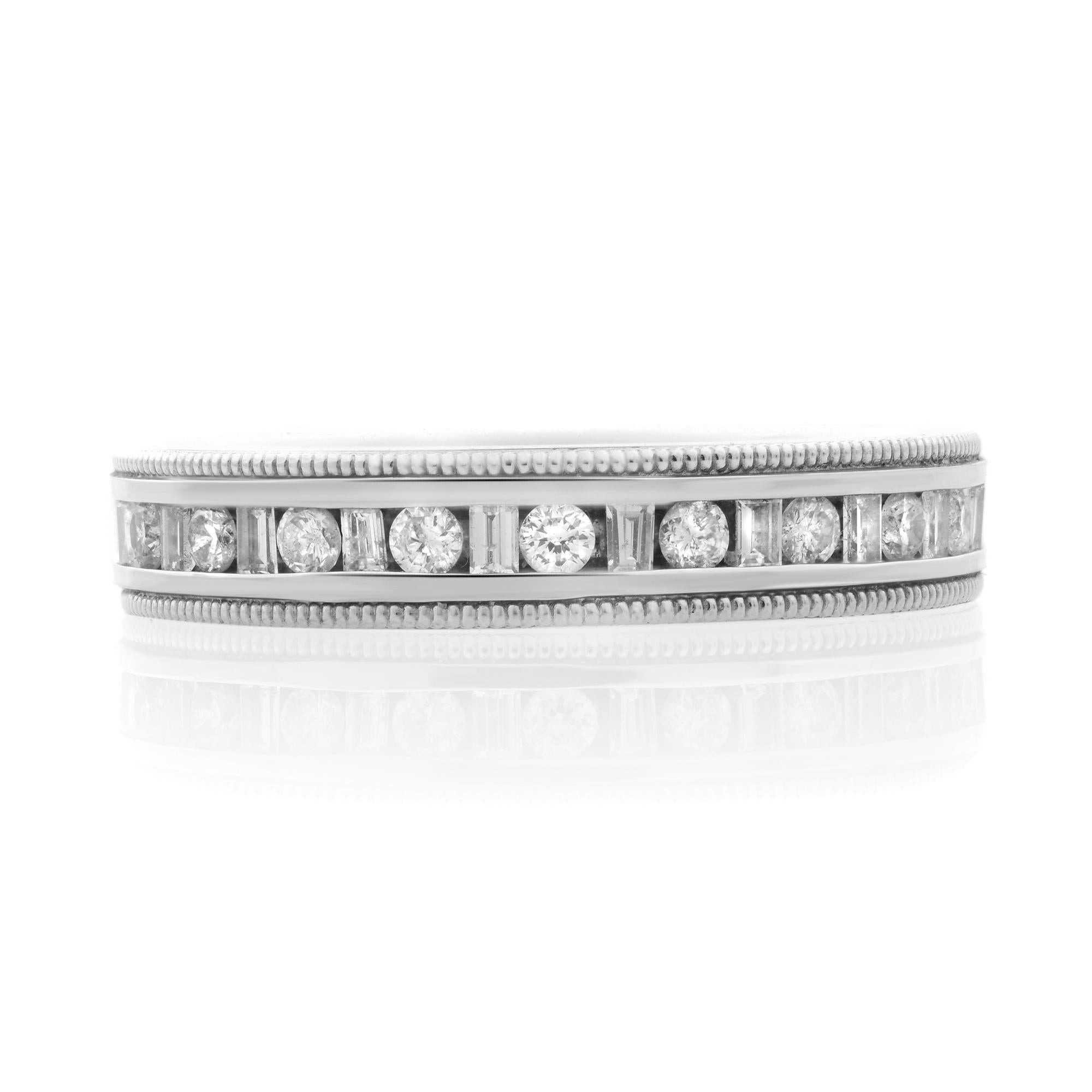 Classic and elegant diamond wedding band rendered in highly polished 14k white gold. This ring features 19 channel set baguette and round brilliant cut diamonds totaling 0.40 carat. Diamond quality: G color and VS-SI clarity. Ring size: 7. Ring
