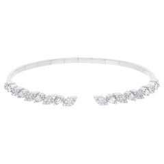 Bracciale aperto con diamanti rotondi e baguette in oro bianco 18 carati Gioielli